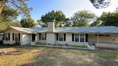 White siding/white brick chimney with Malarkey Silverwood