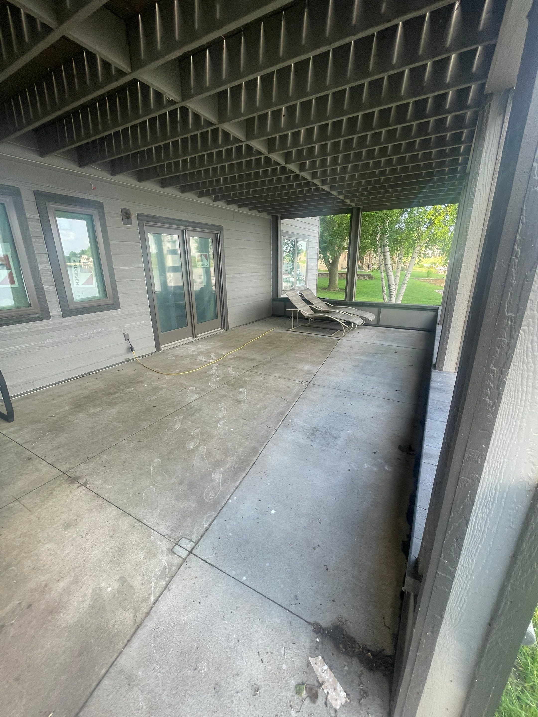 Lakefront Screened Patio Concrete Coating Installation in Wentworth by Select Painting, Coatings & Garage Cabinets