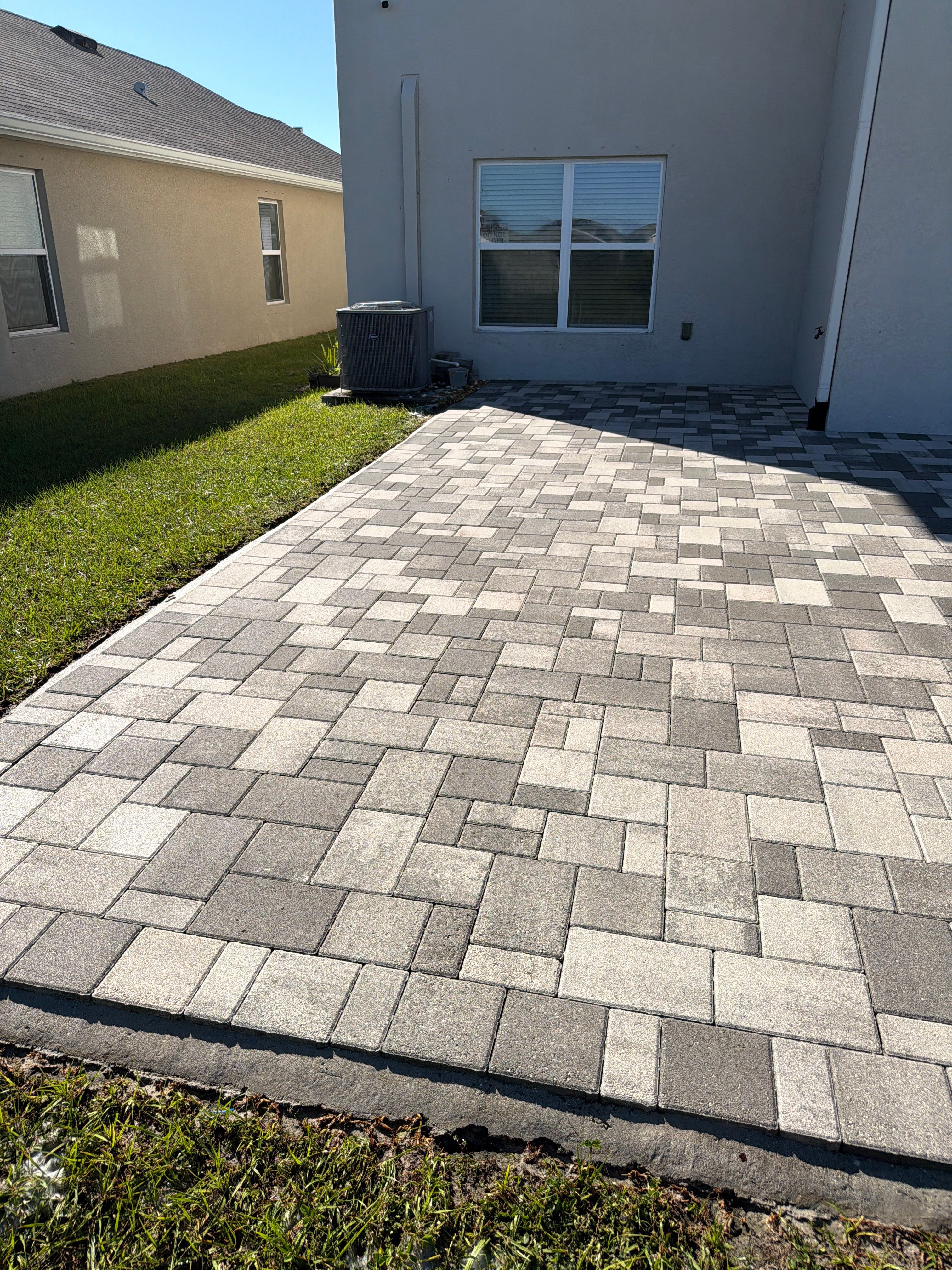 Paver Sealing and Restoration for Large Multi-Toned Patio in Wimauma by Supreme Paver Experts