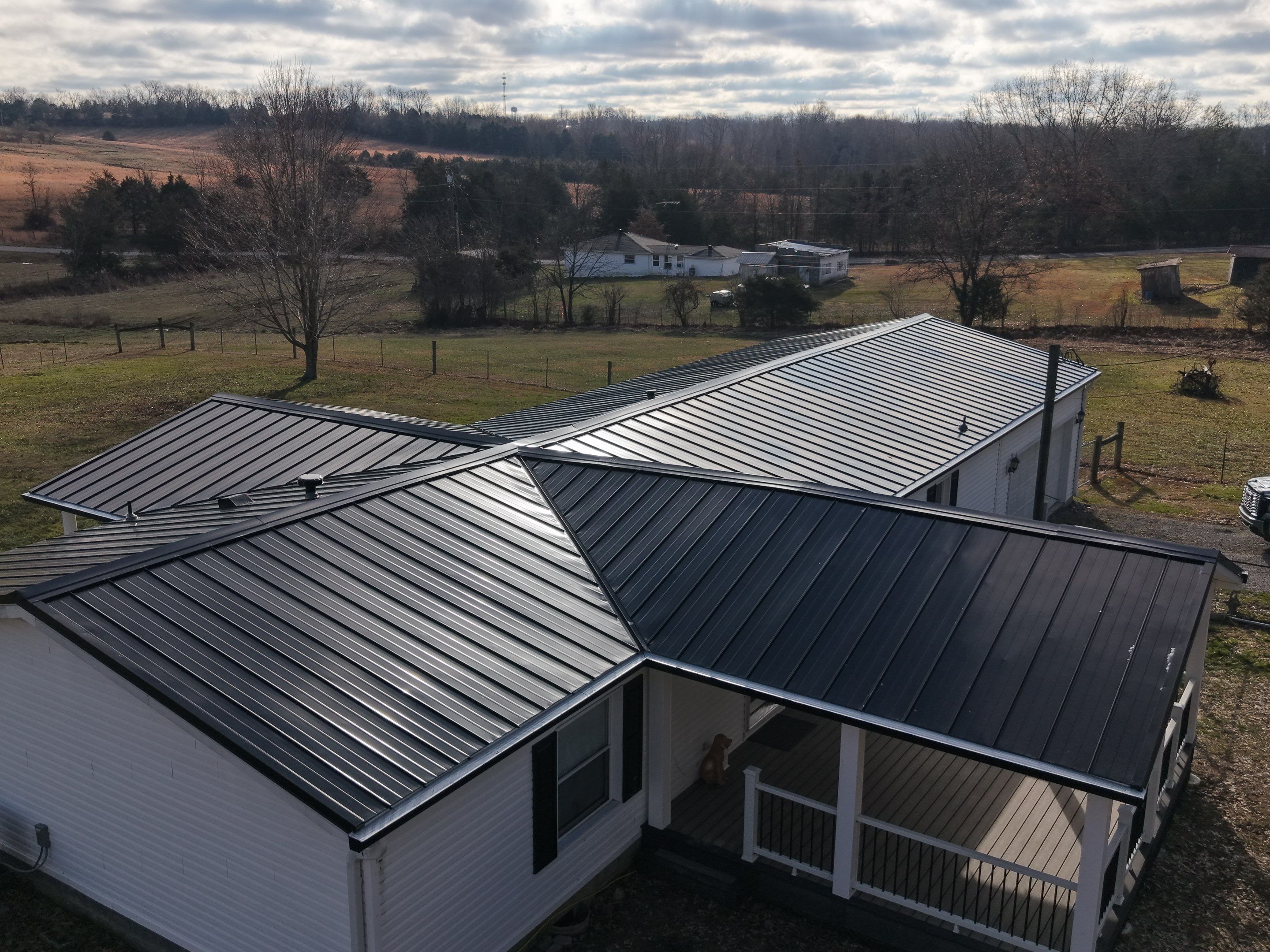 Standing Seam Roof & Black Gutters by Stout Exteriors