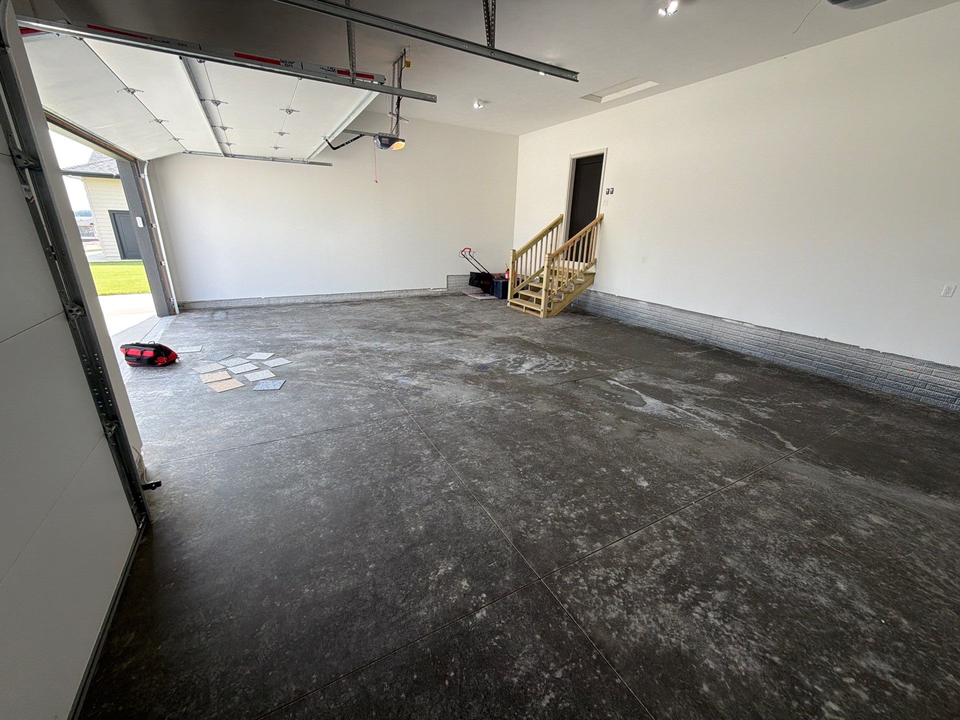 Cabin Fever Decorative Flake Garage Floor Coating in Sioux Falls by Select Painting, Coatings & Garage Cabinets