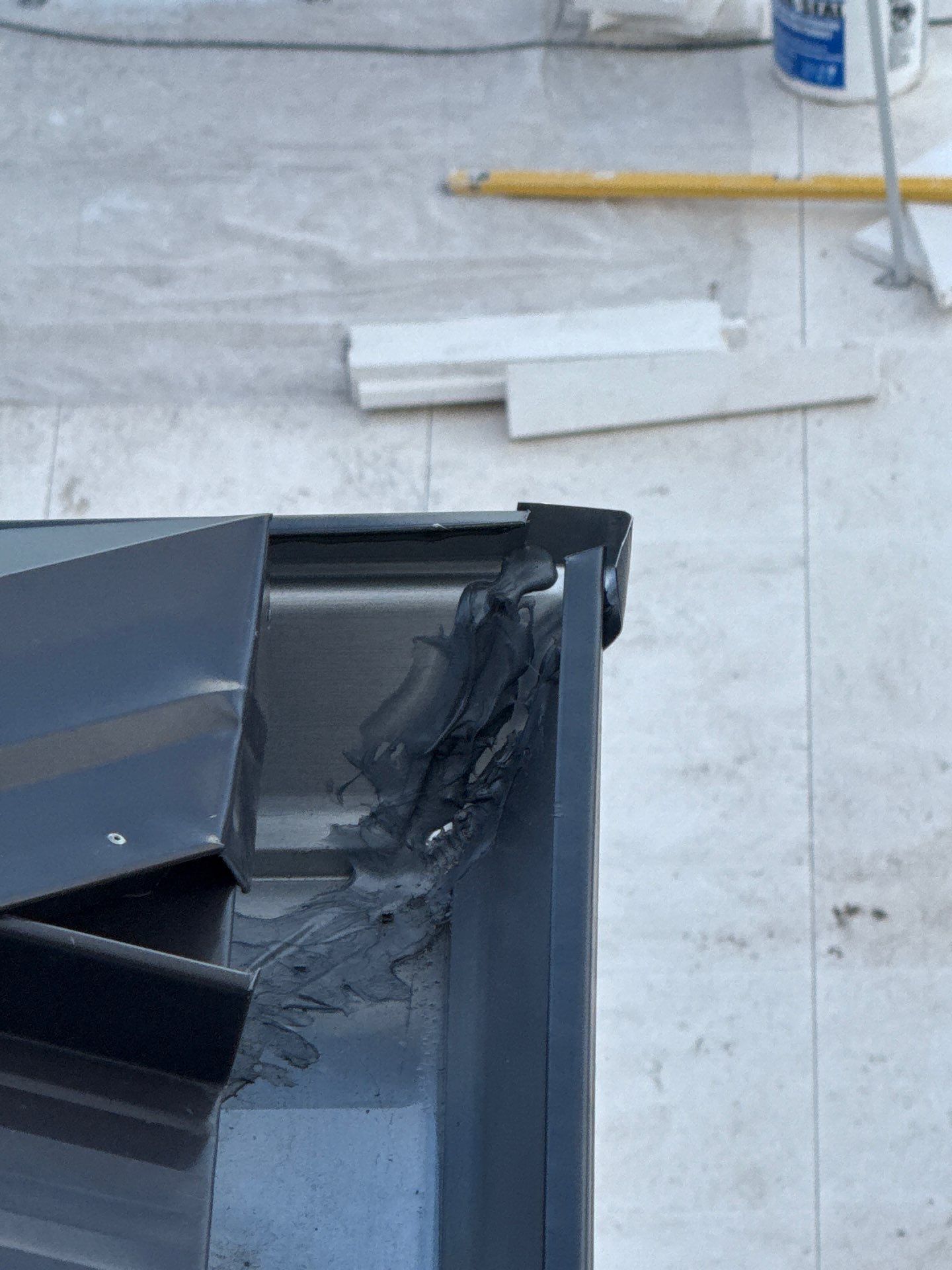 Seamless Aluminum Gutter Installation using black seamless gutters in Sarasota FL by Gutter Professors