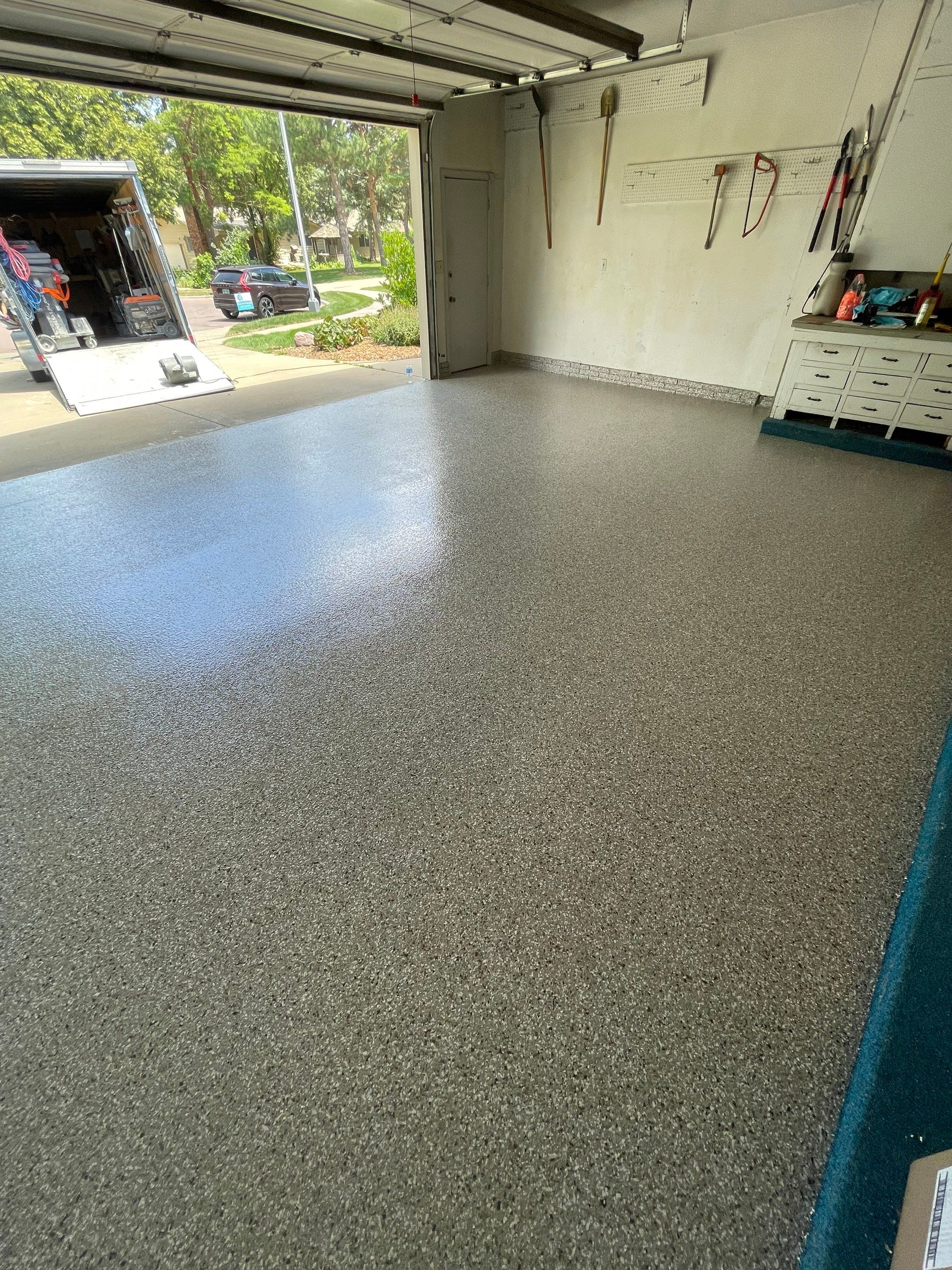 Custom Creekbed Garage Floor Coating in Sioux Falls by Select Painting, Coatings & Garage Cabinets