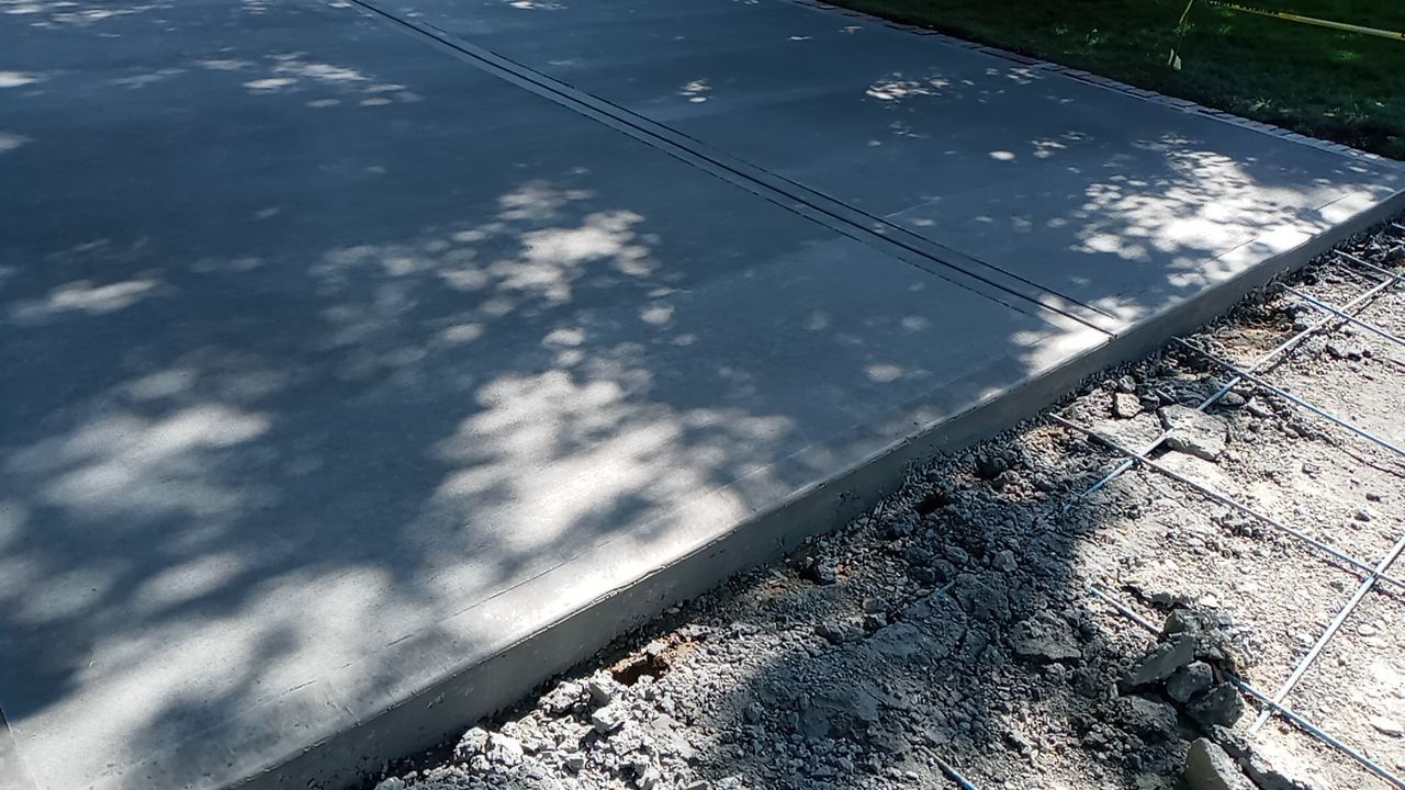 New Driveway and Sidewalk by LAND ESCAPES LLC