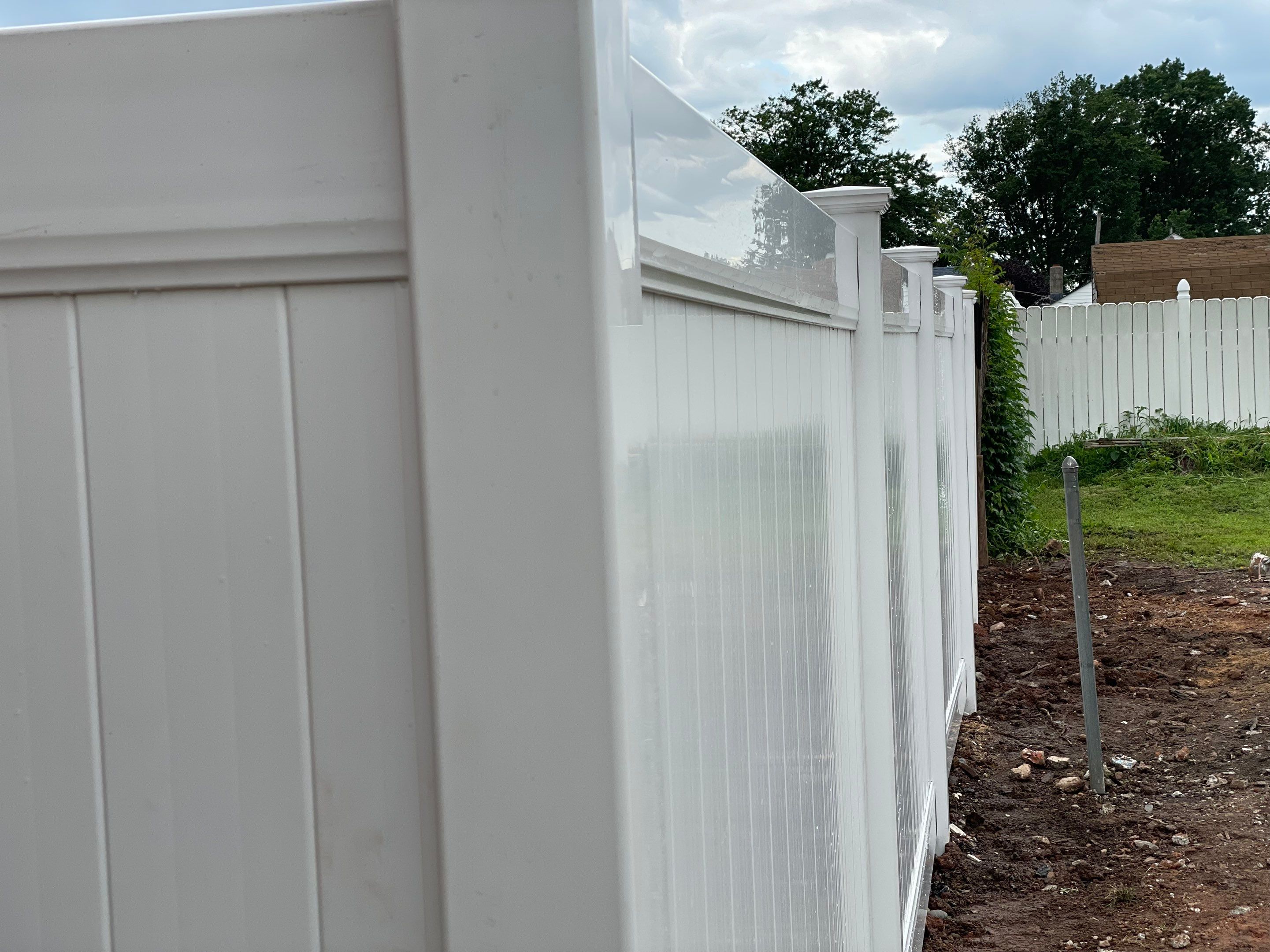 Fence Installation using White Fence by Home Concepts Construction