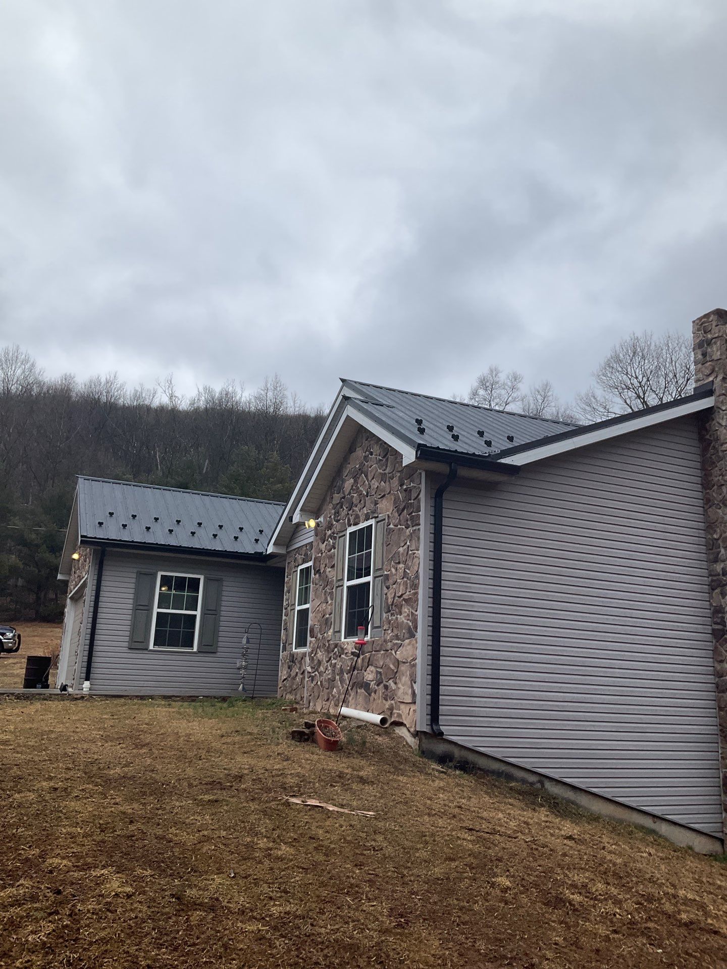 Black Metal Roof Replacement and Gutter Installation in Halifax by Esh Builders