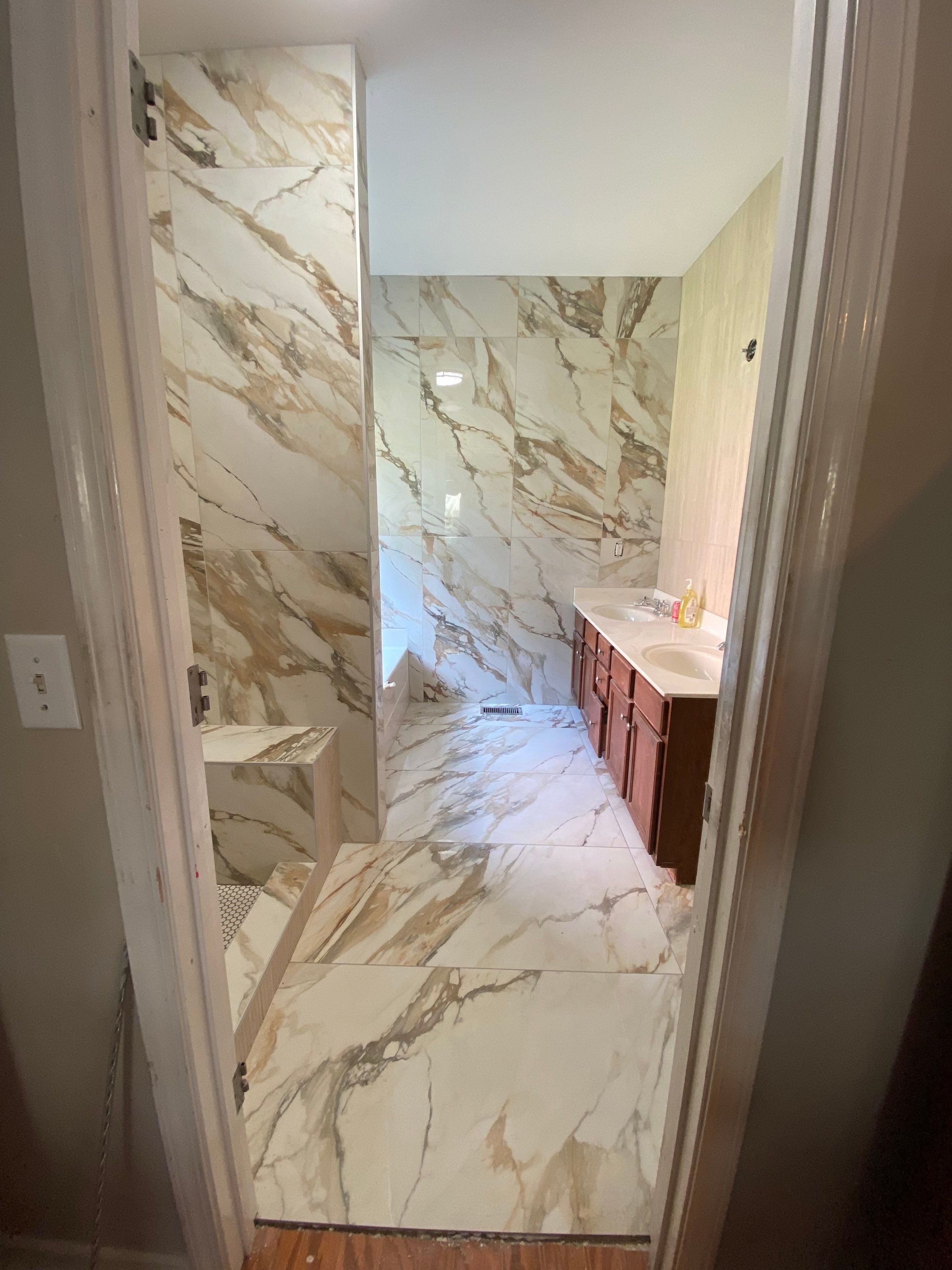 Beautiful new custom tile shower, tub surround and accent walls by Footprints Floors of Nashville