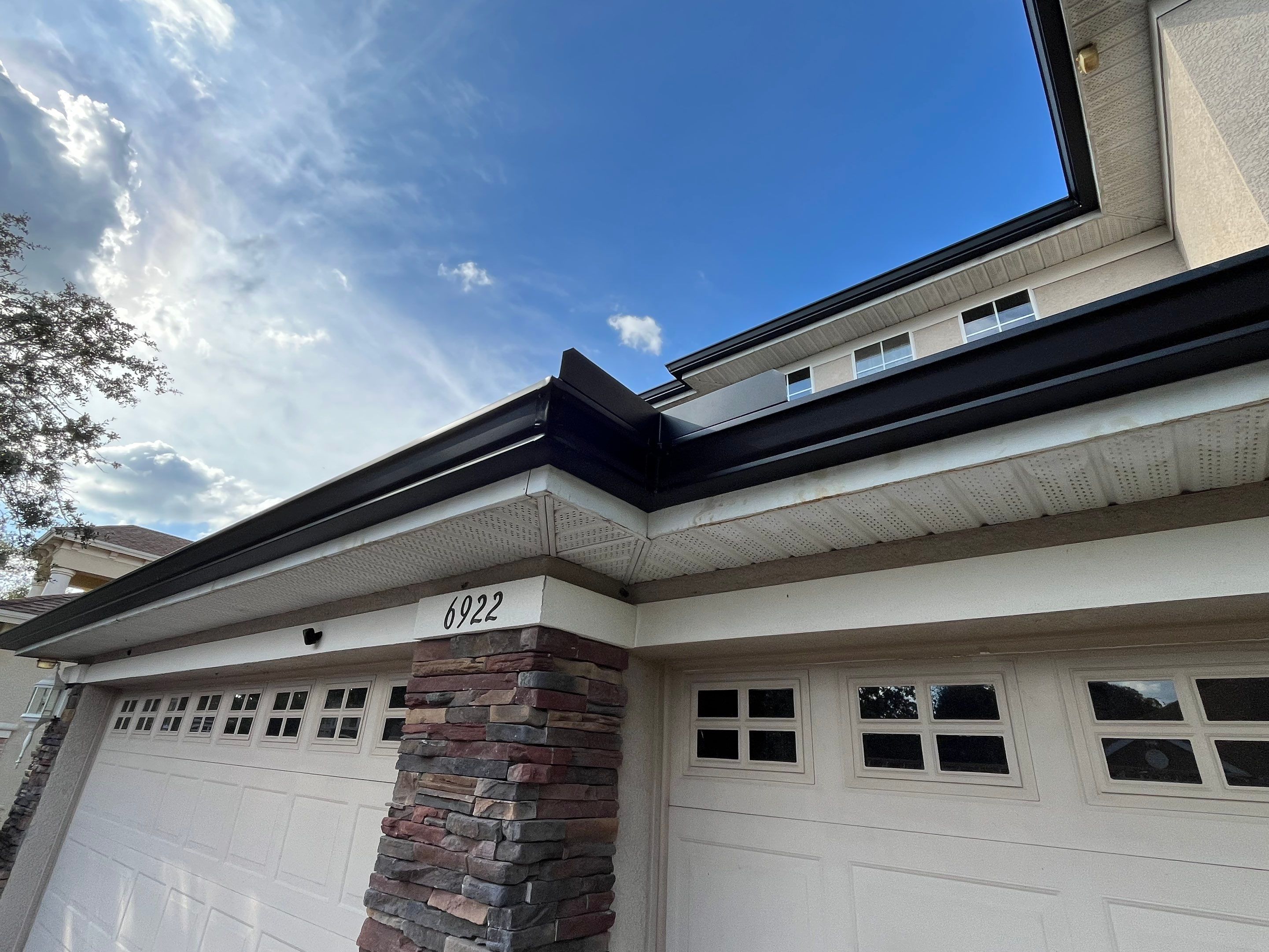 Black 6-inch Seamless Gutters for Modern Ellenton Homes FL by Gutter Professors