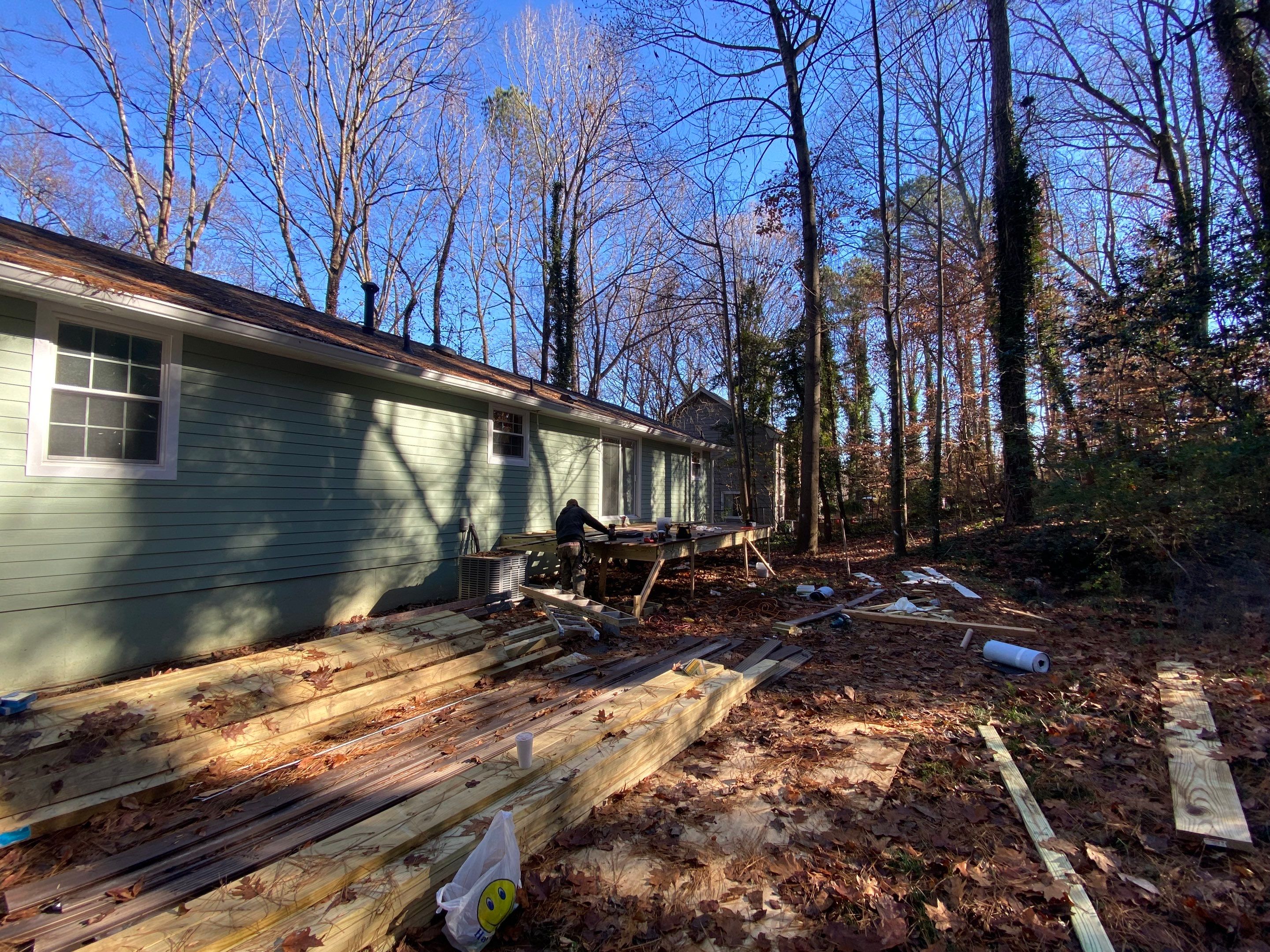 Elevated Wood Deck Construction With Black Metal Railings In Atlanta by Swift Home Renovations