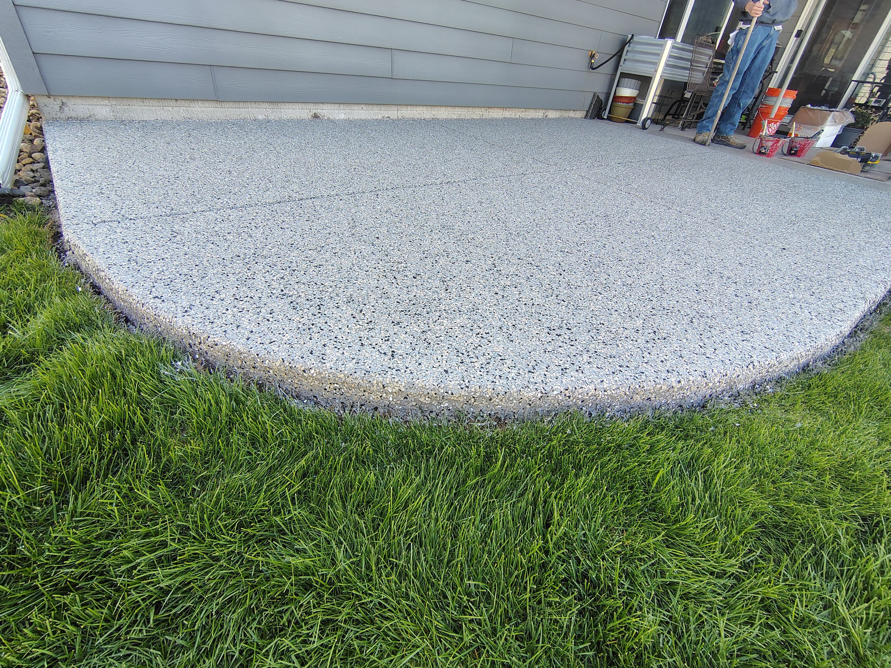 Speckled Concrete Patio Coating Installation in Sioux Falls by Select Painting, Coatings & Garage Cabinets