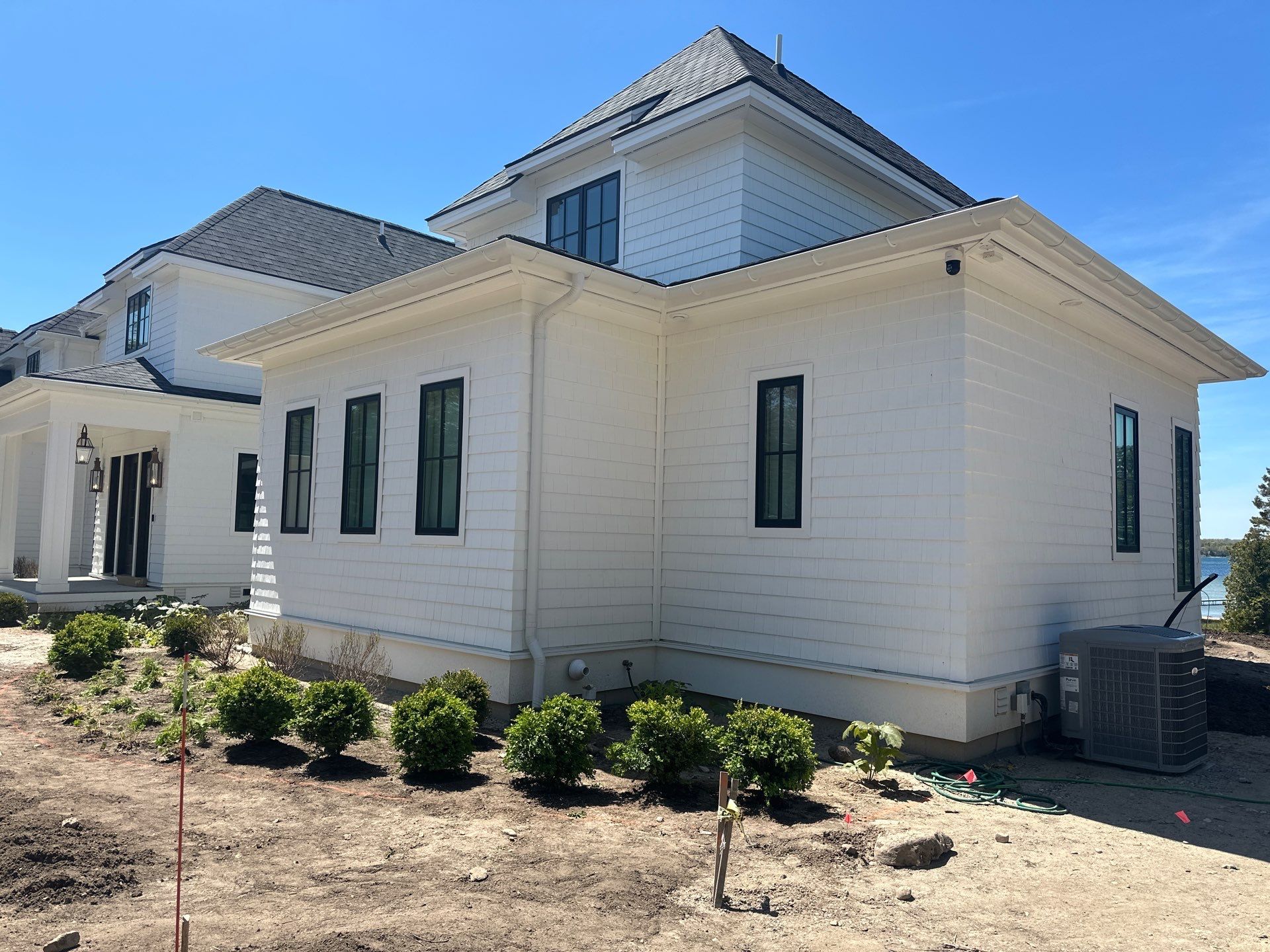 Gutter System and Exterior Drainage Installation in Charlevoix by Rainbow Seamless Systems