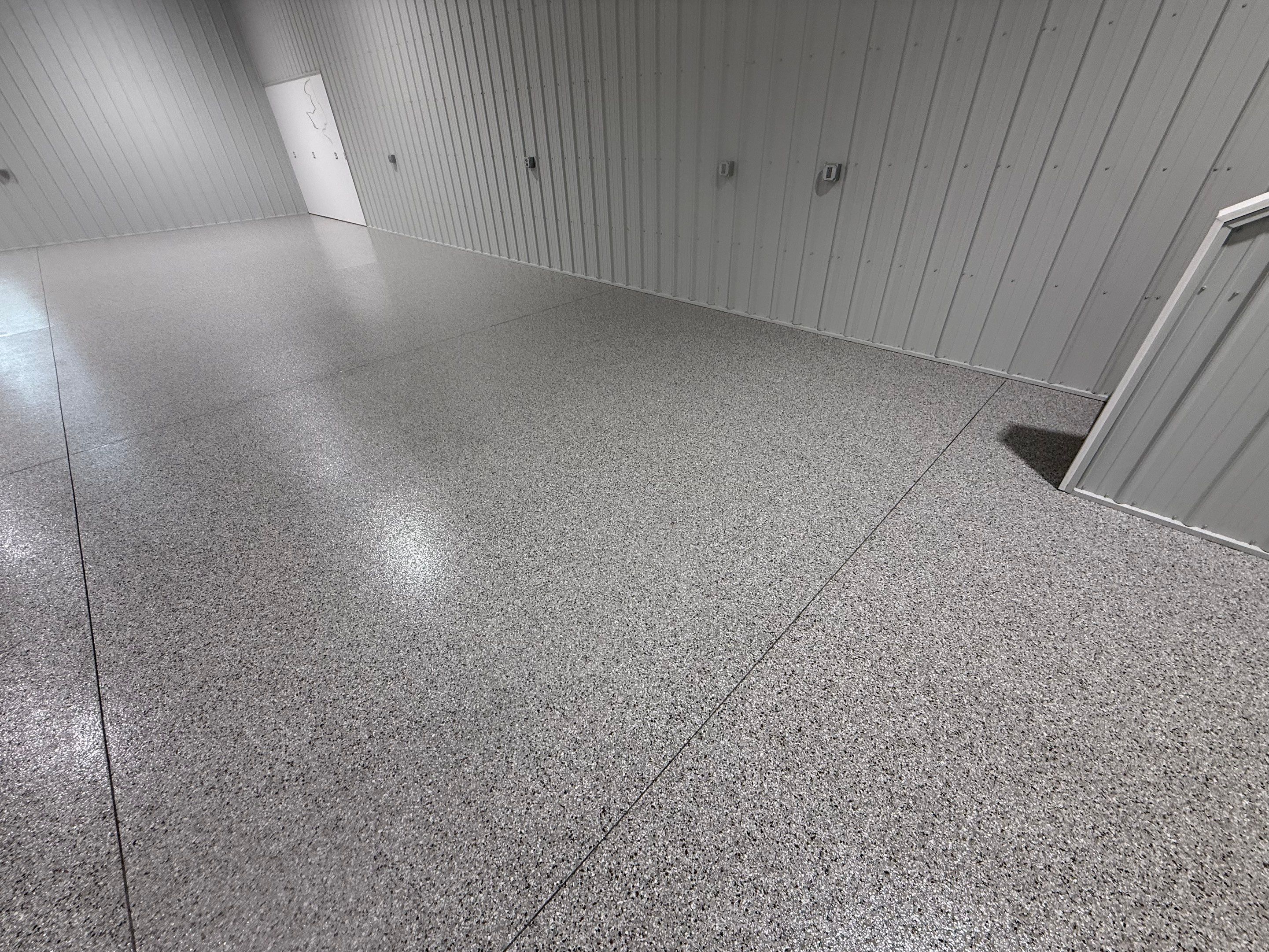 Custom Speckled Floor Coating for Large Montrose Shop by Select Painting, Coatings & Garage Cabinets