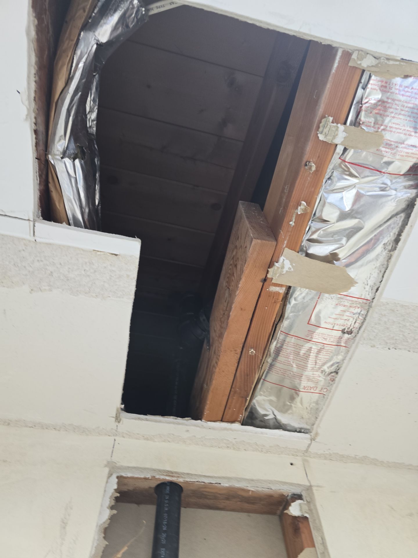 Installation of New Tall Black Piping (Wall to Ceiling) & Underground Piping by Us Plumbing