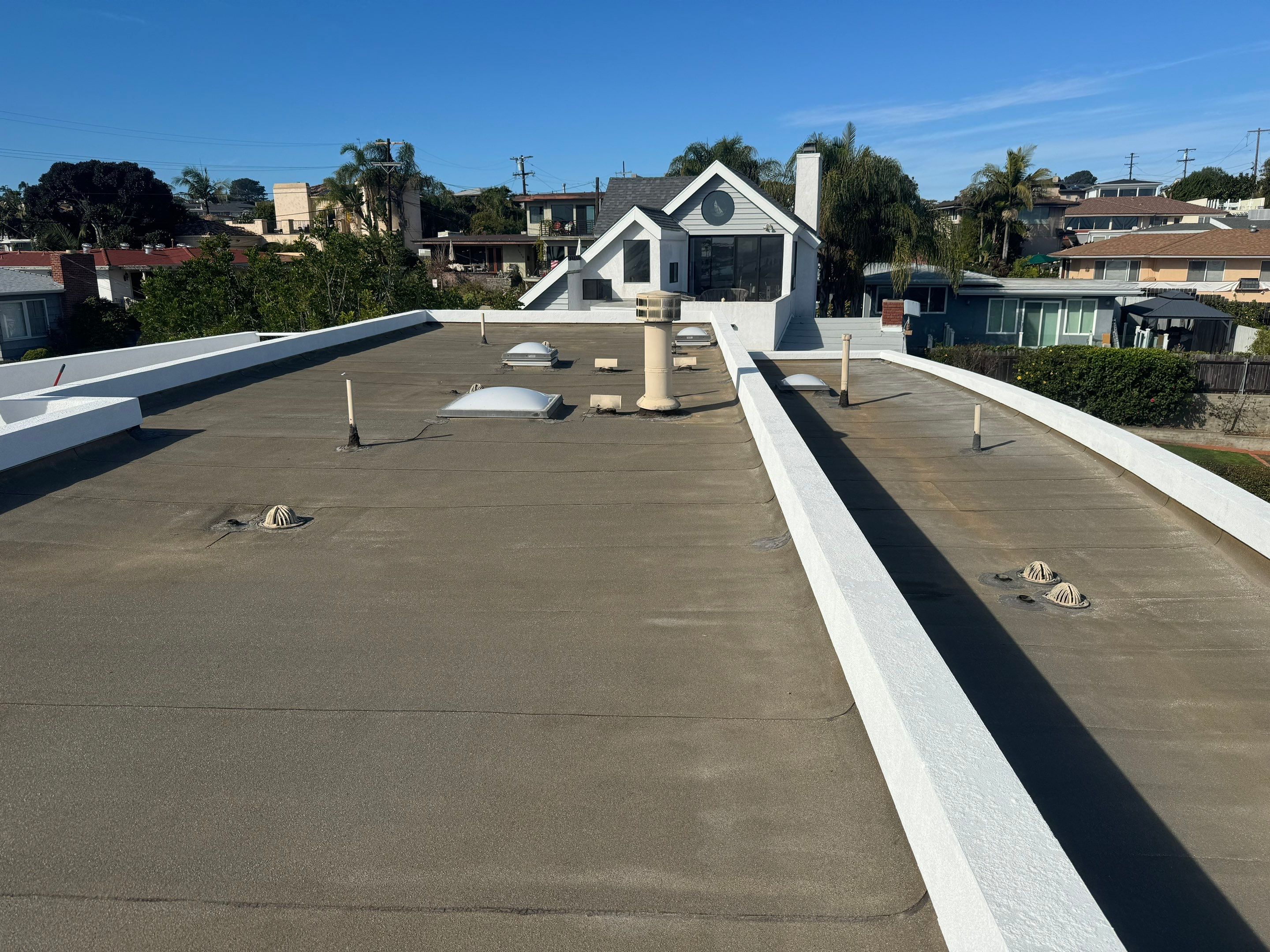 Point Loma Flat Roof Replacement – Johns Manville Bright White Torch-Applied Roofing System by Zenith Roofing Services 