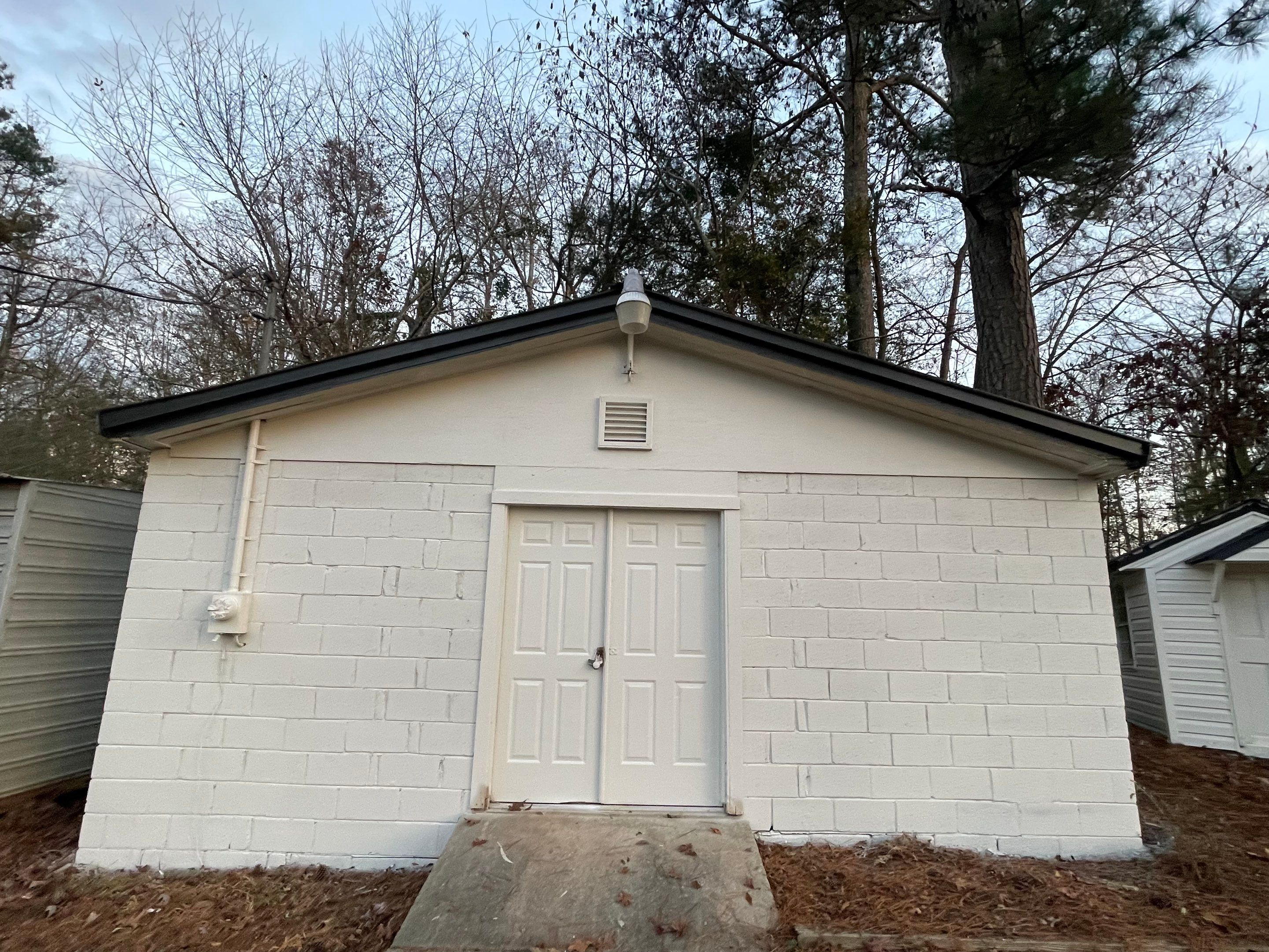 White Masonry Painting and Exterior Home Refresh in Covington by PGP Surface Solutions, LLC