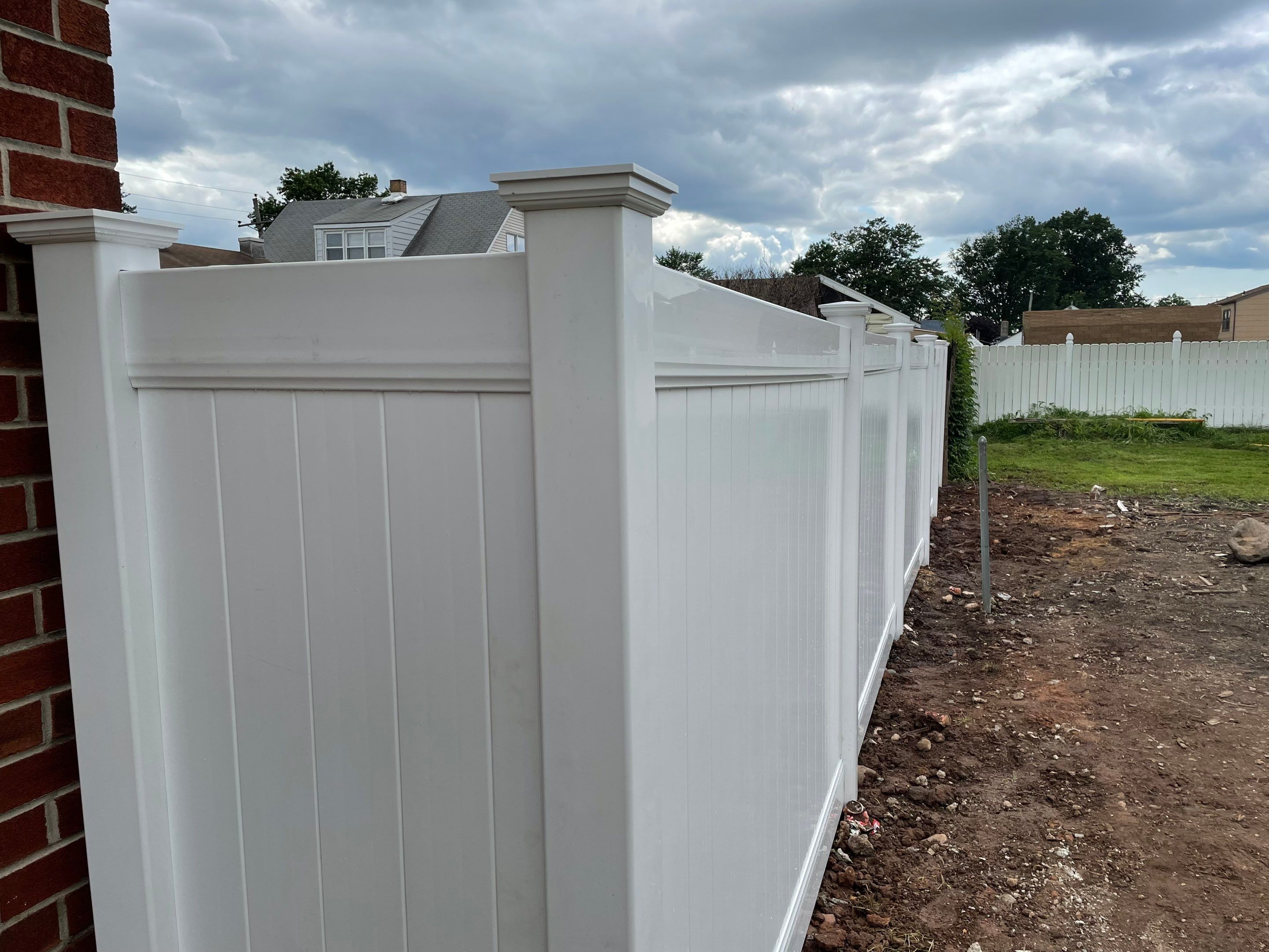 Fence Installation using White Fence by Home Concepts Construction