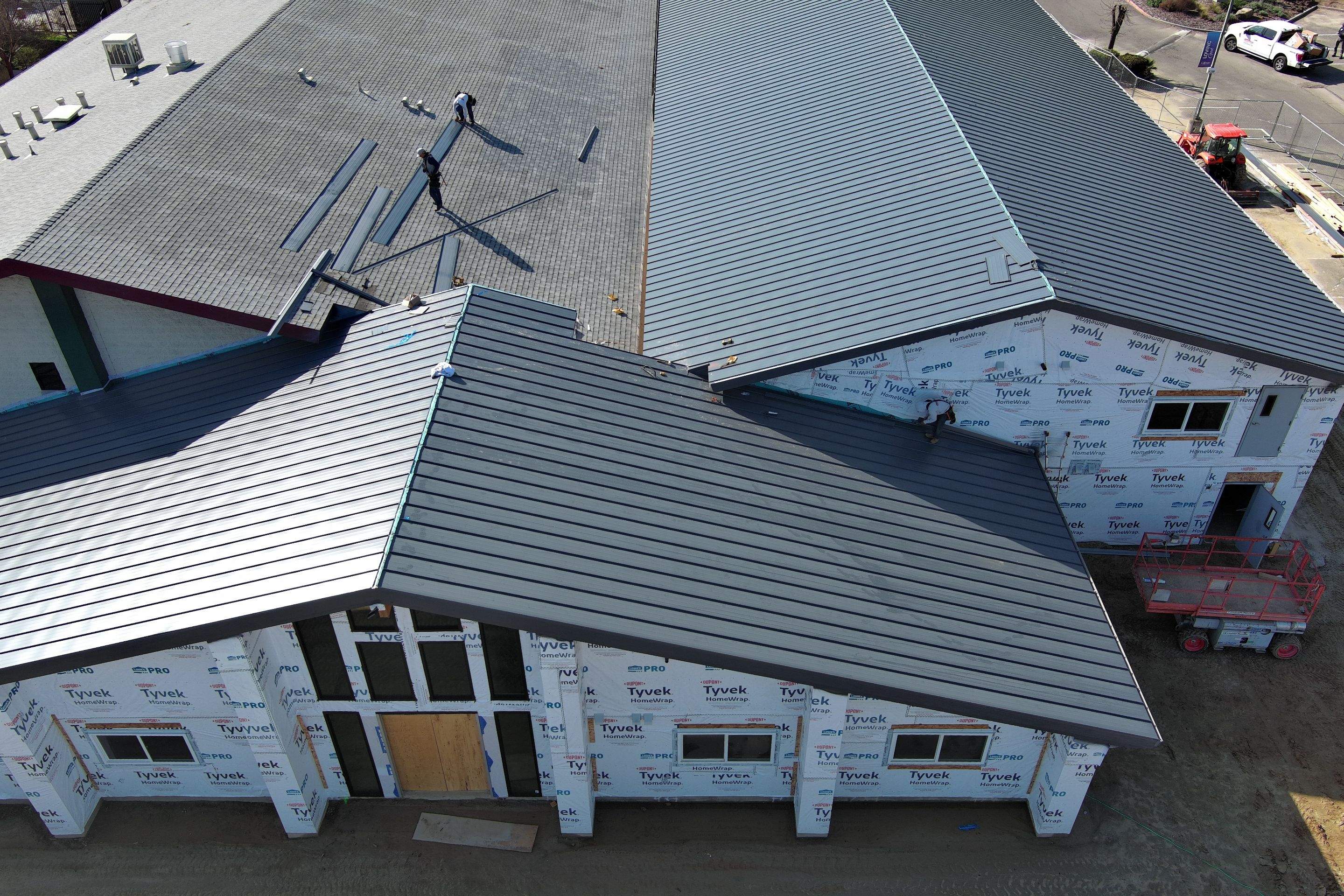 Metal roofing installation on church by Straight Edge Roofing Inc