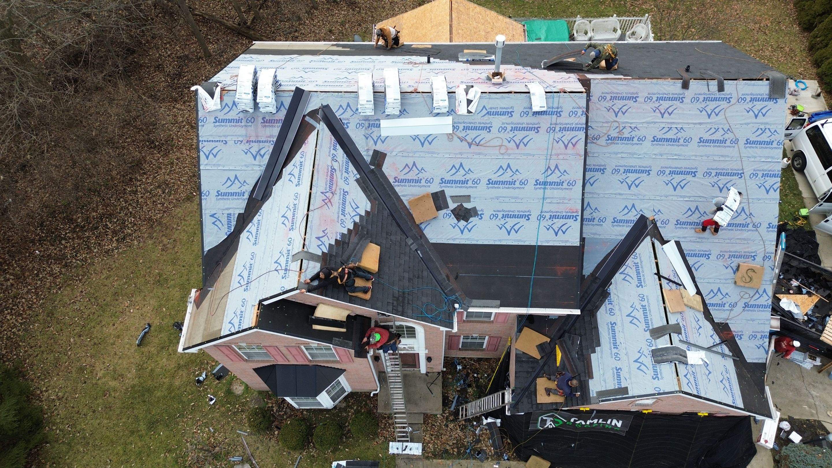 Walden Ponds - Pristine Black and Hydro Flo Gutter Guards by Tamlin Roofing