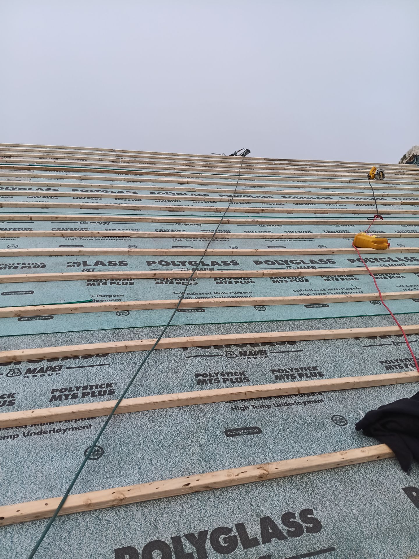 Off with the Tile and on with the TILCOR stone coated metal.  by Bayfront Roofing and Construction