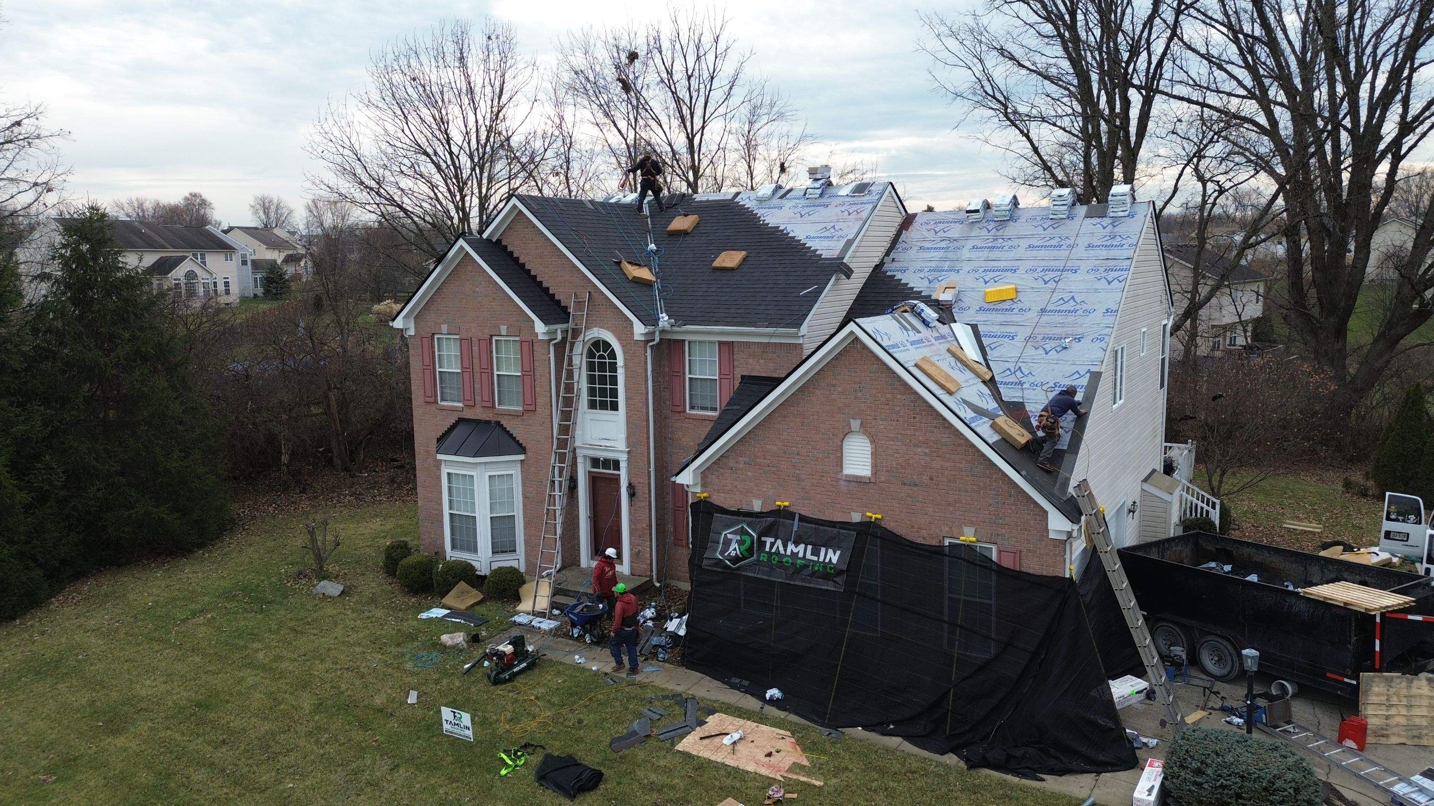 Walden Ponds - Pristine Black and Hydro Flo Gutter Guards by Tamlin Roofing
