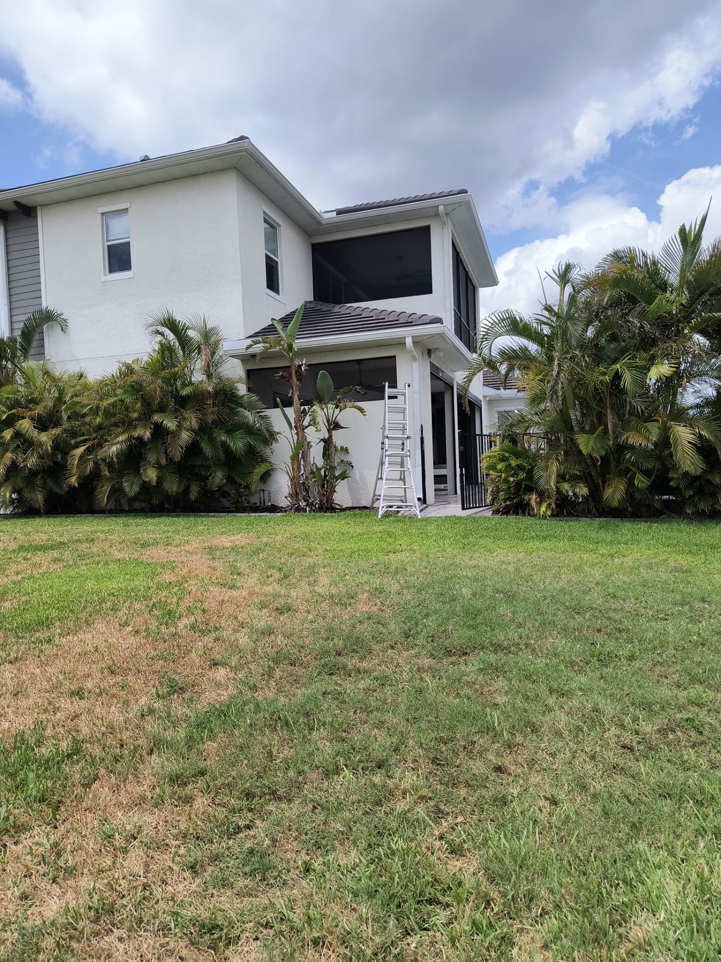 White Seamless Gutters with Downspouts in Bradenton FL by Gutter Professors