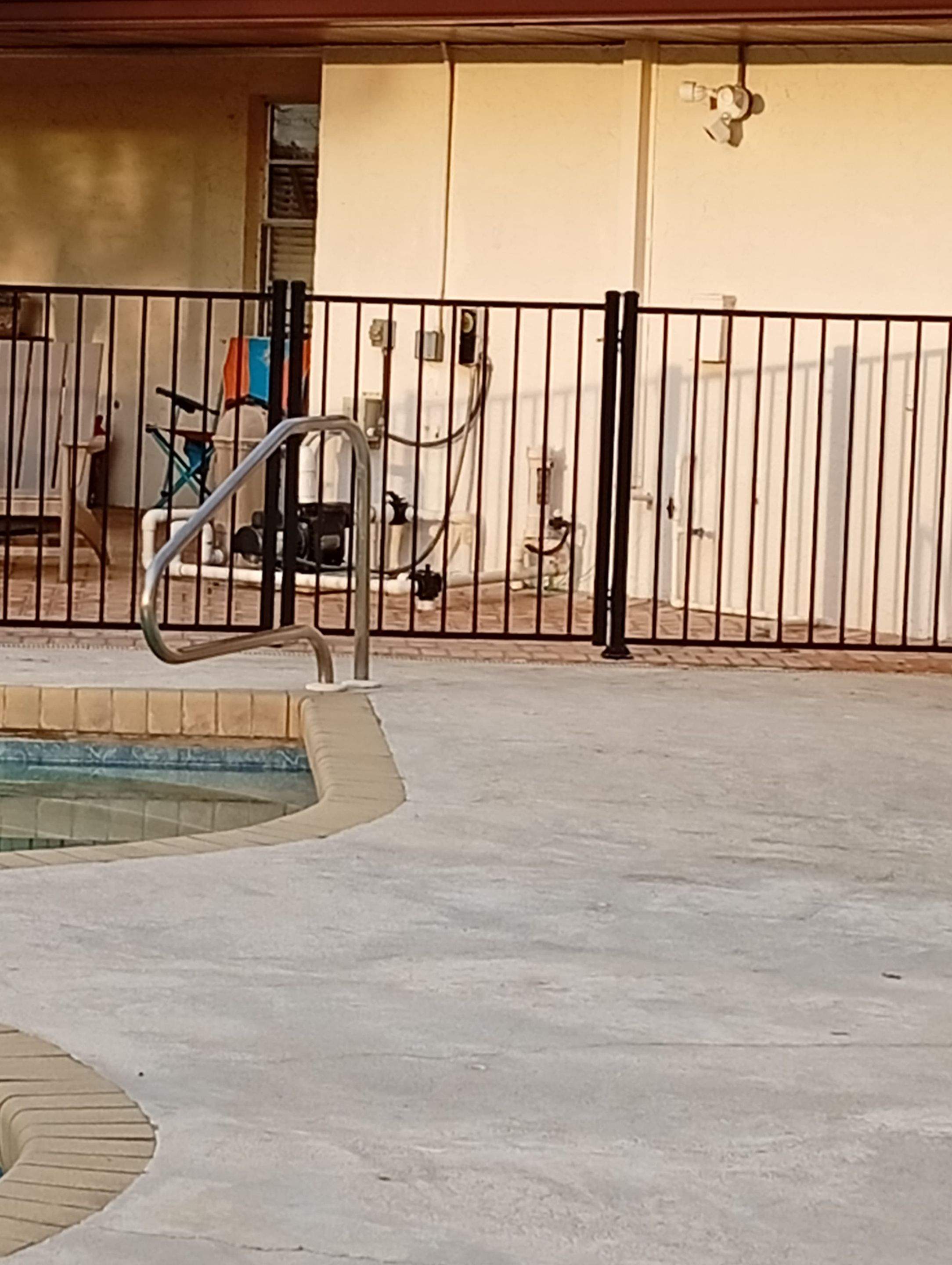 Black Aluminum Pool Safety Fence Installation in Punta Gorda by True Fence LLC