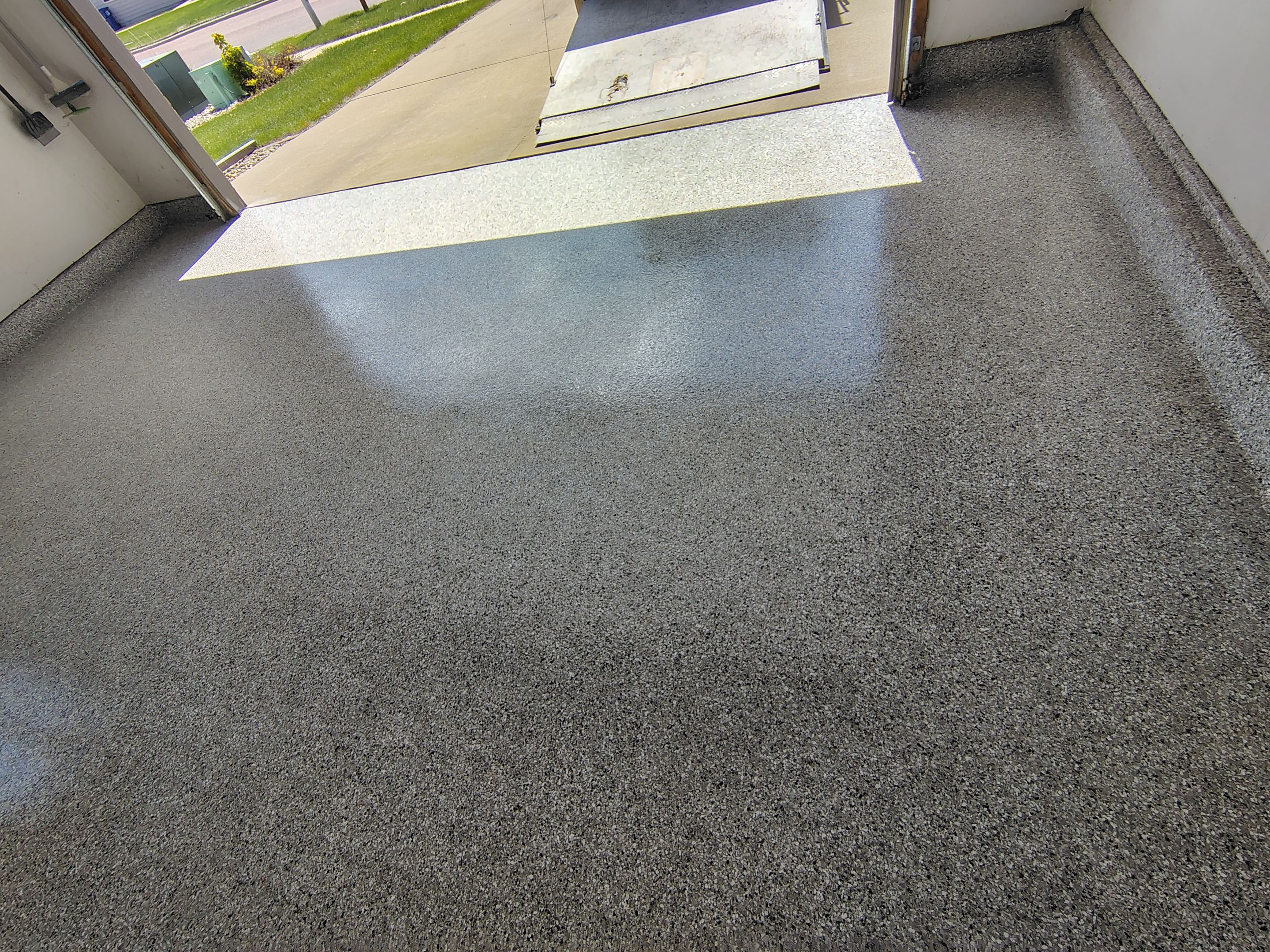 Decorative Chip Epoxy Garage Floor Coating in Sioux Falls by Select Painting, Coatings & Garage Cabinets