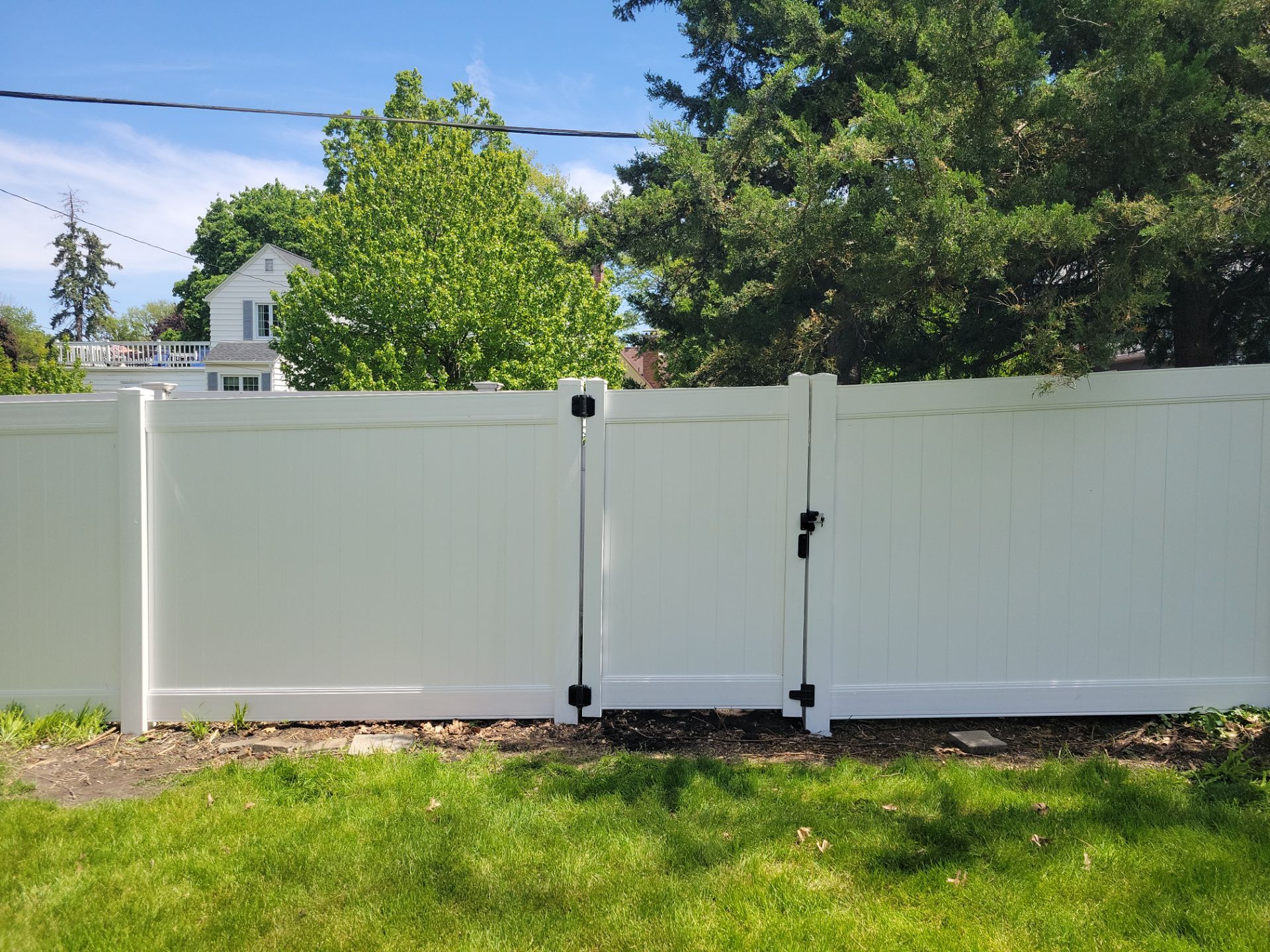 Residential White Vinyl Privacy Fence Installation in Waterloo by Perfect Picket Fence and Stain