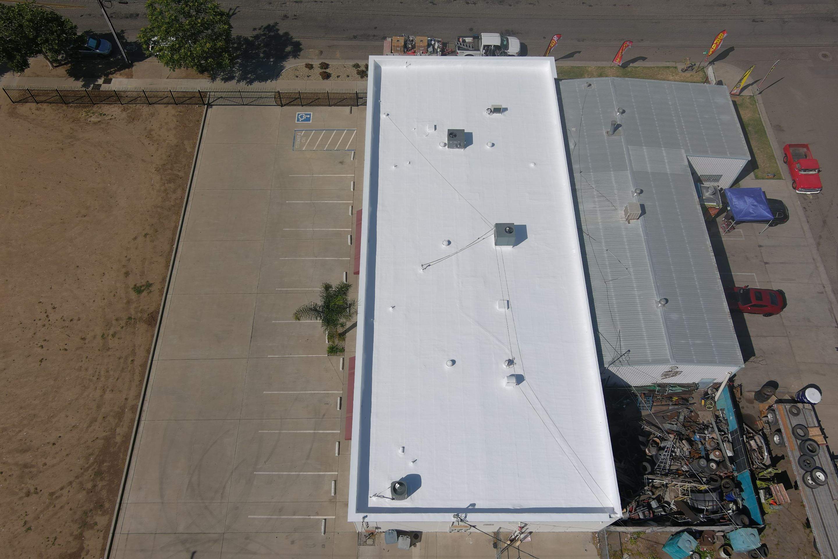 Spray foam and coatings using Conklin Benchmark/PUMA XL coatings and spray foam by Straight Edge Roofing Inc
