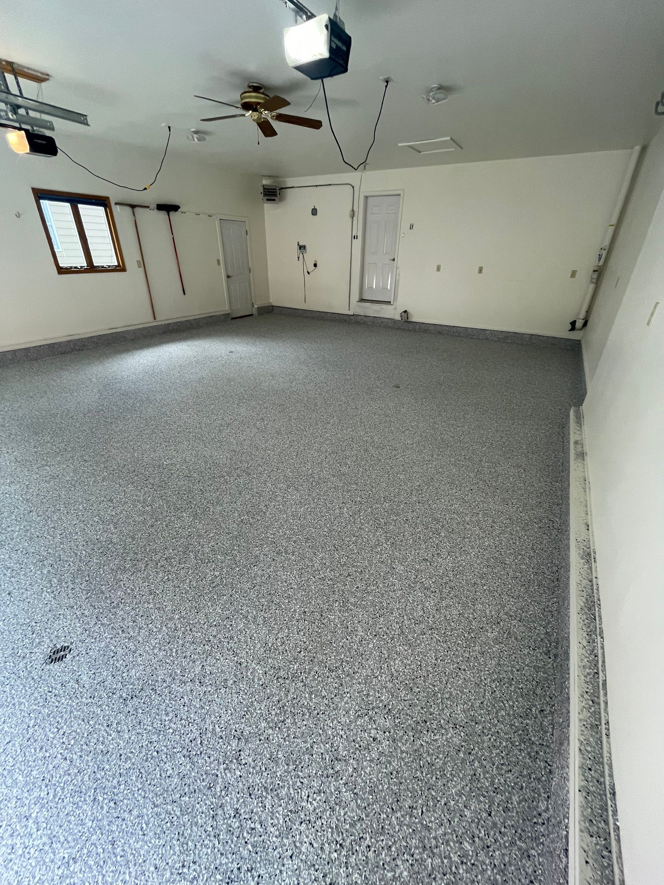 Madison Garage Concrete Coating with Feather Grey Speckle Finish by Select Painting, Coatings & Garage Cabinets