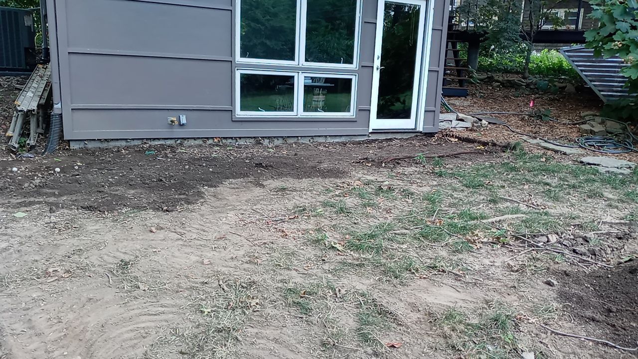 Back Yard Cantilivered Patio by LAND ESCAPES LLC