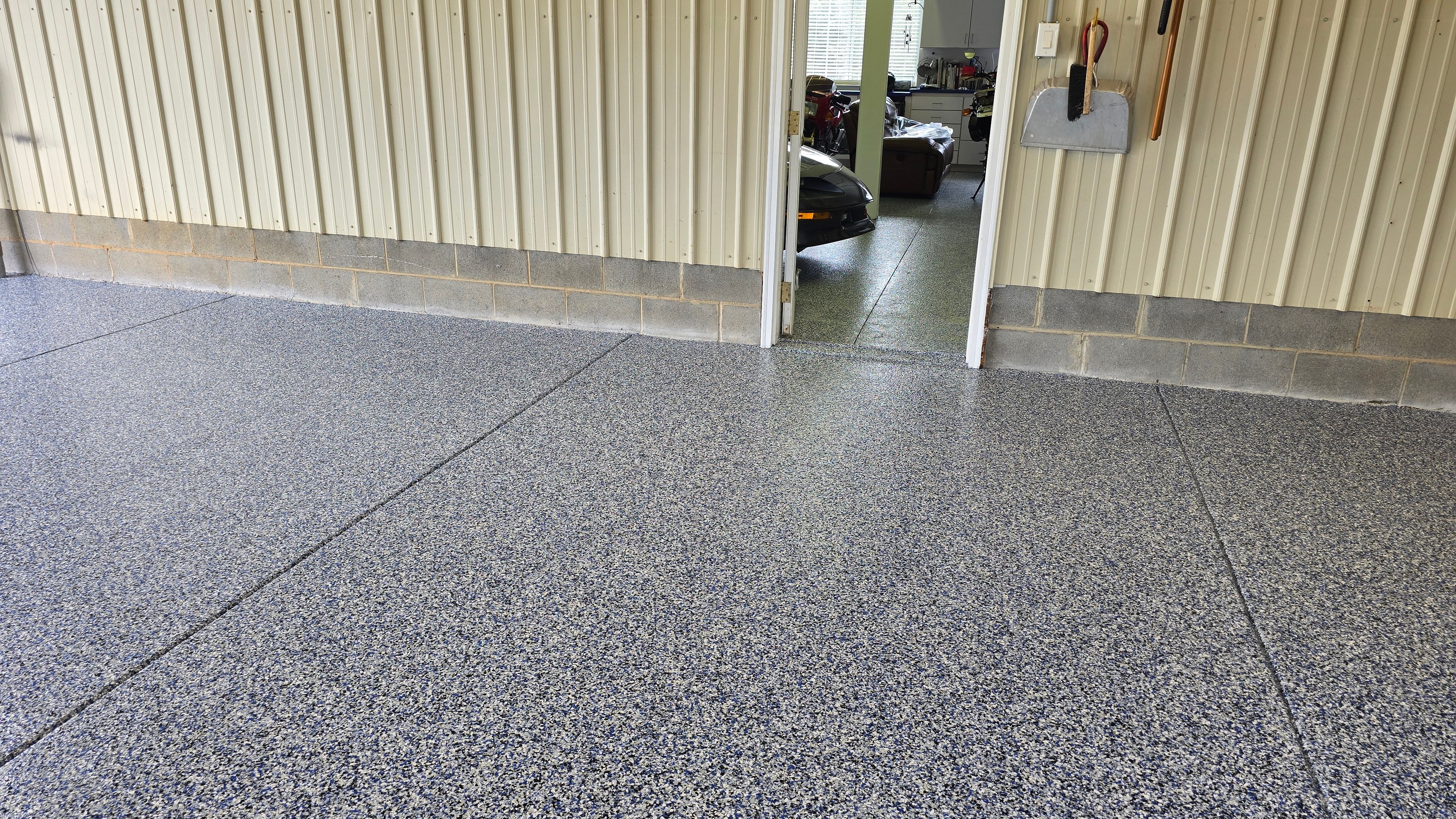 Two garages completed using Shoreline and Midnight by Elite Floor Solutions