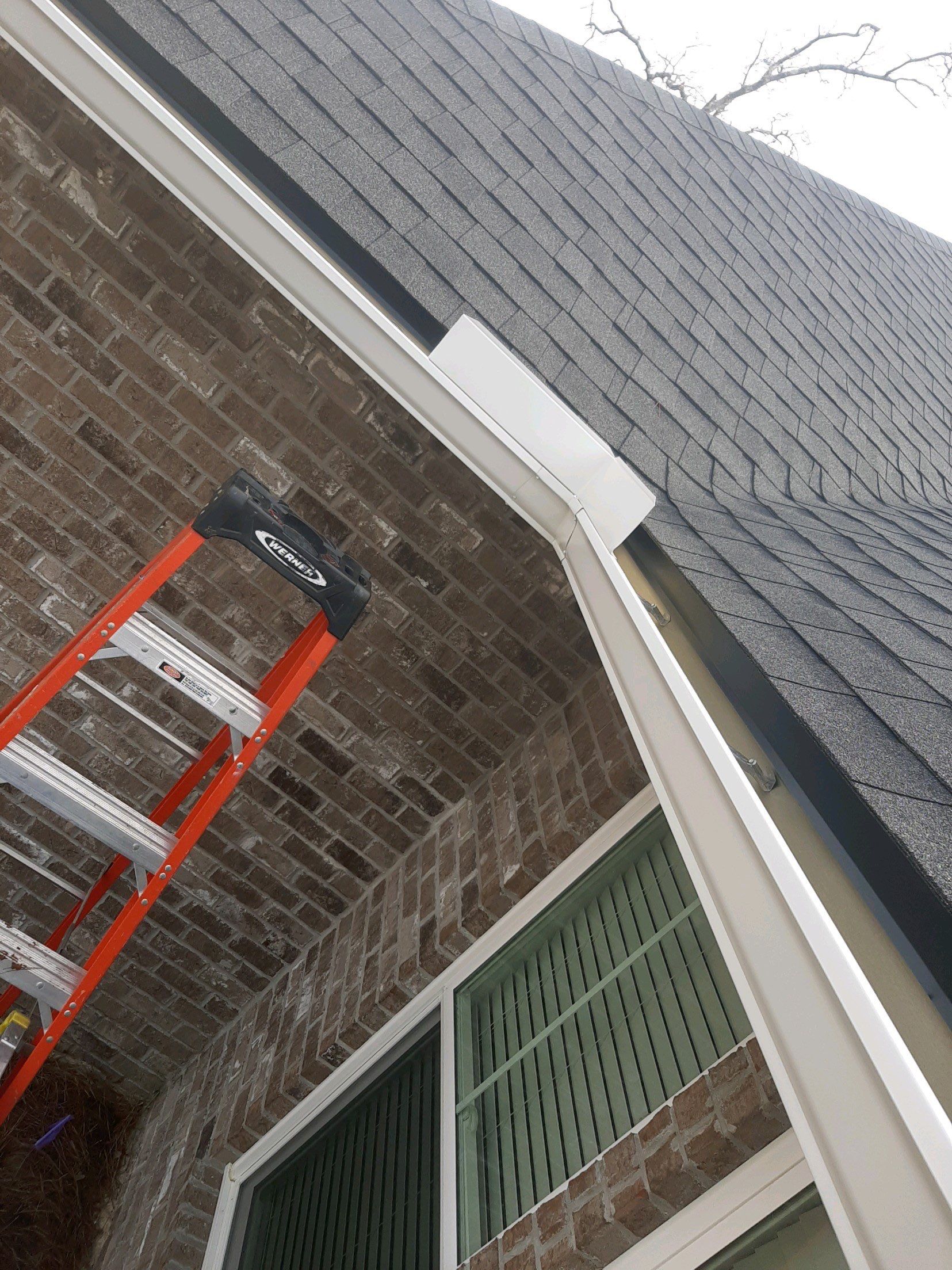 Seamless Gutter Installation Using White K-Style Gutters by Gutter Professors