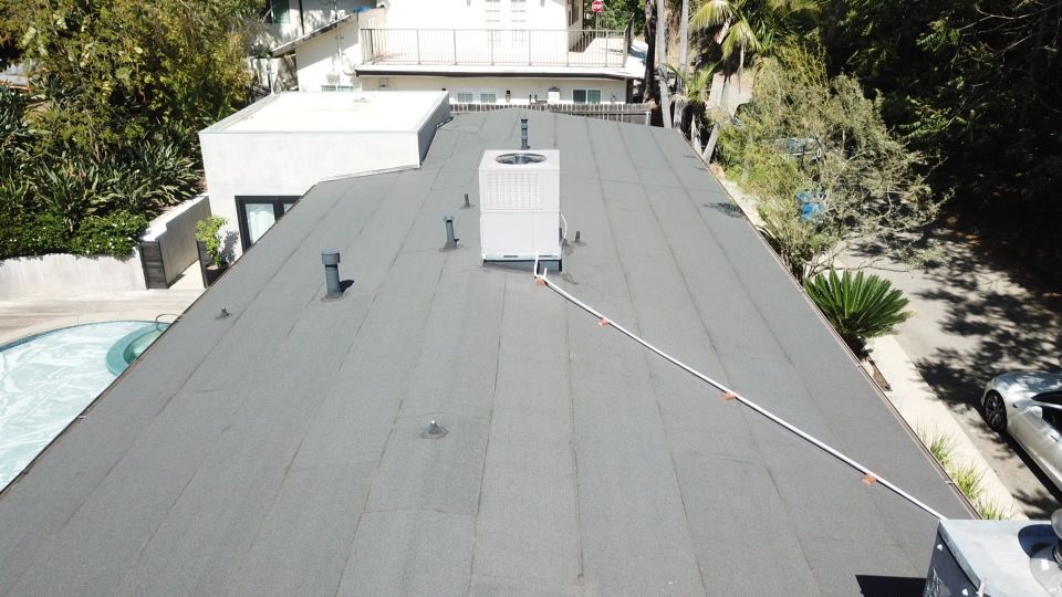 Residential Roofing Installation using Polyfresko® G Highly Reflective Modified Bitumen Cap Sheet by Hull Brothers Roofing