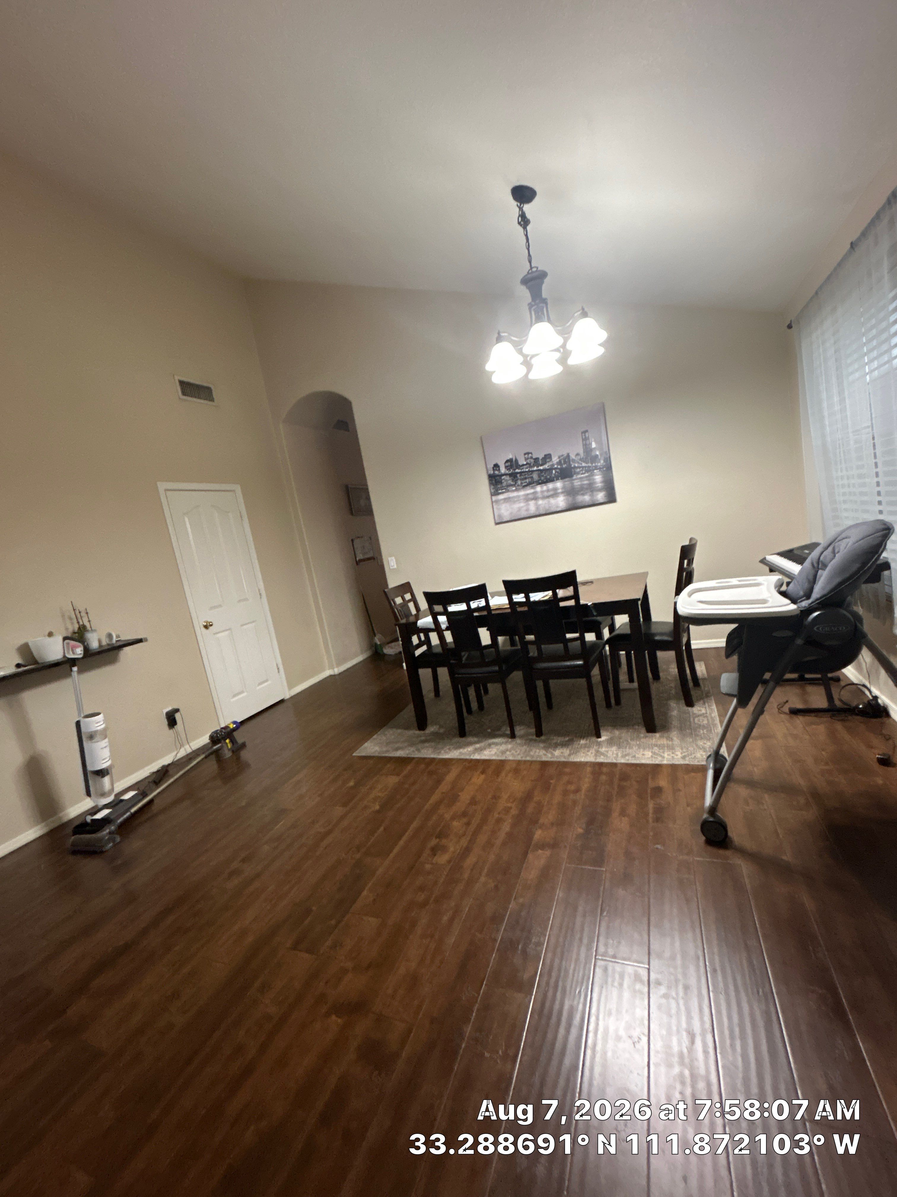 Modern Dining Room Renovation With Dark Wood Floors and Lighting by CompanyCam Sales Demo