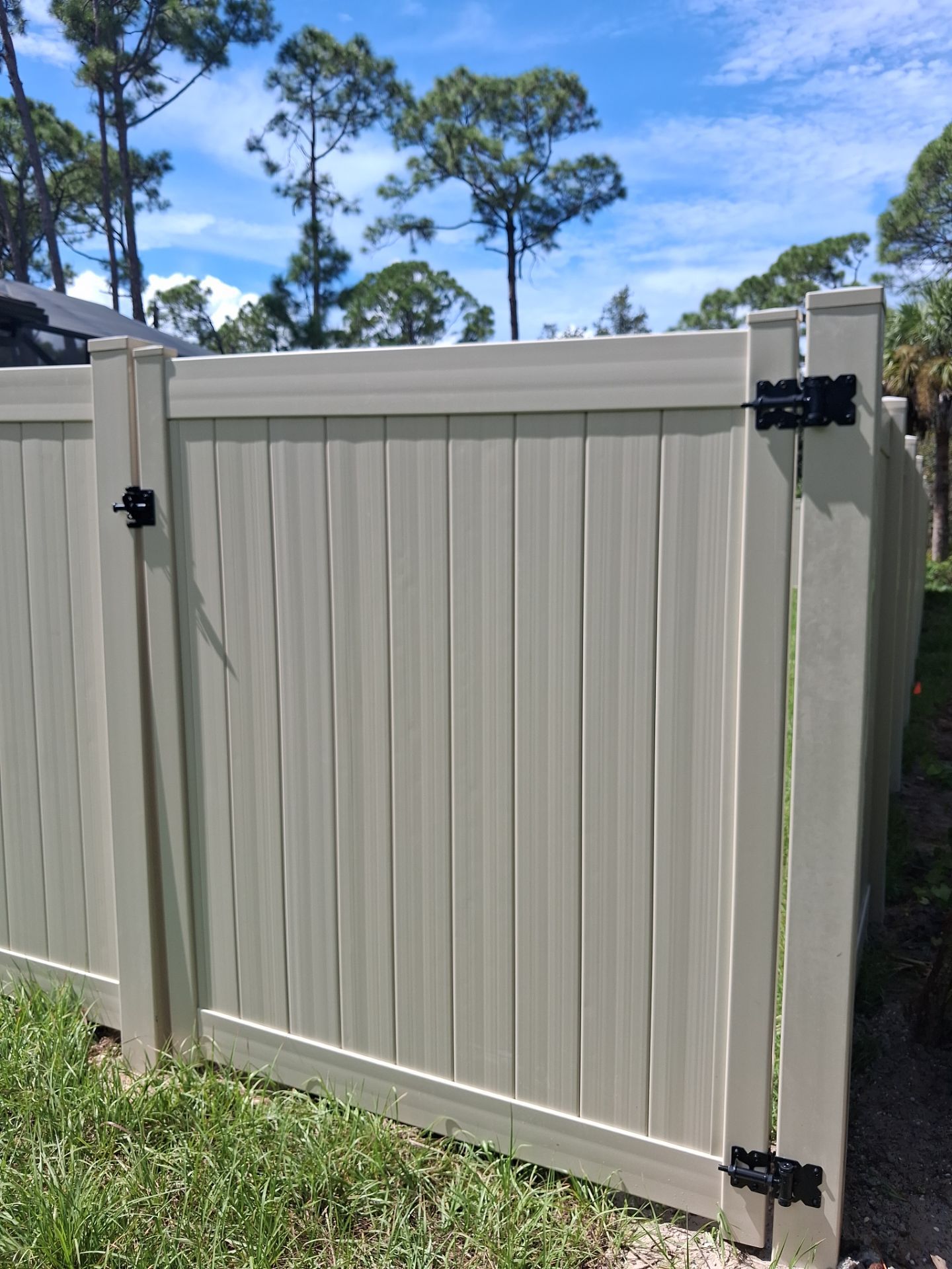 Tan Vinyl Privacy Fence and Gate Installation in Port Charlotte by True Fence LLC