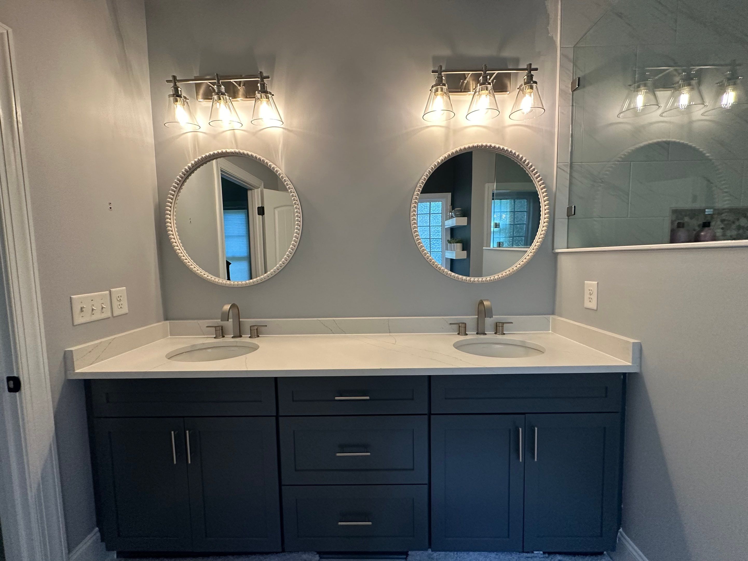 Bright Bathroom Remodel with Wall Removal, Stand Alone Tub and New Vanity by Footprints Floors of Coastal Carolina