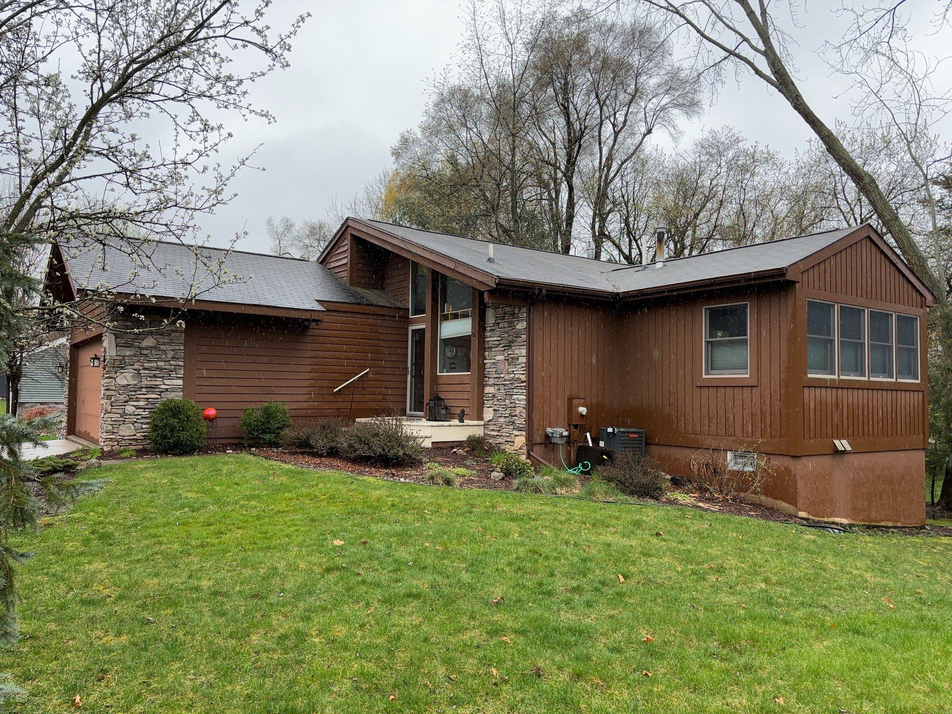 Installing new Roof and Gutter Protection after Hail Damage by Acme Exteriors
