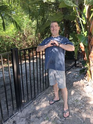 Black Aluminum Picket Fence Installation for Port Charlotte Canal Home