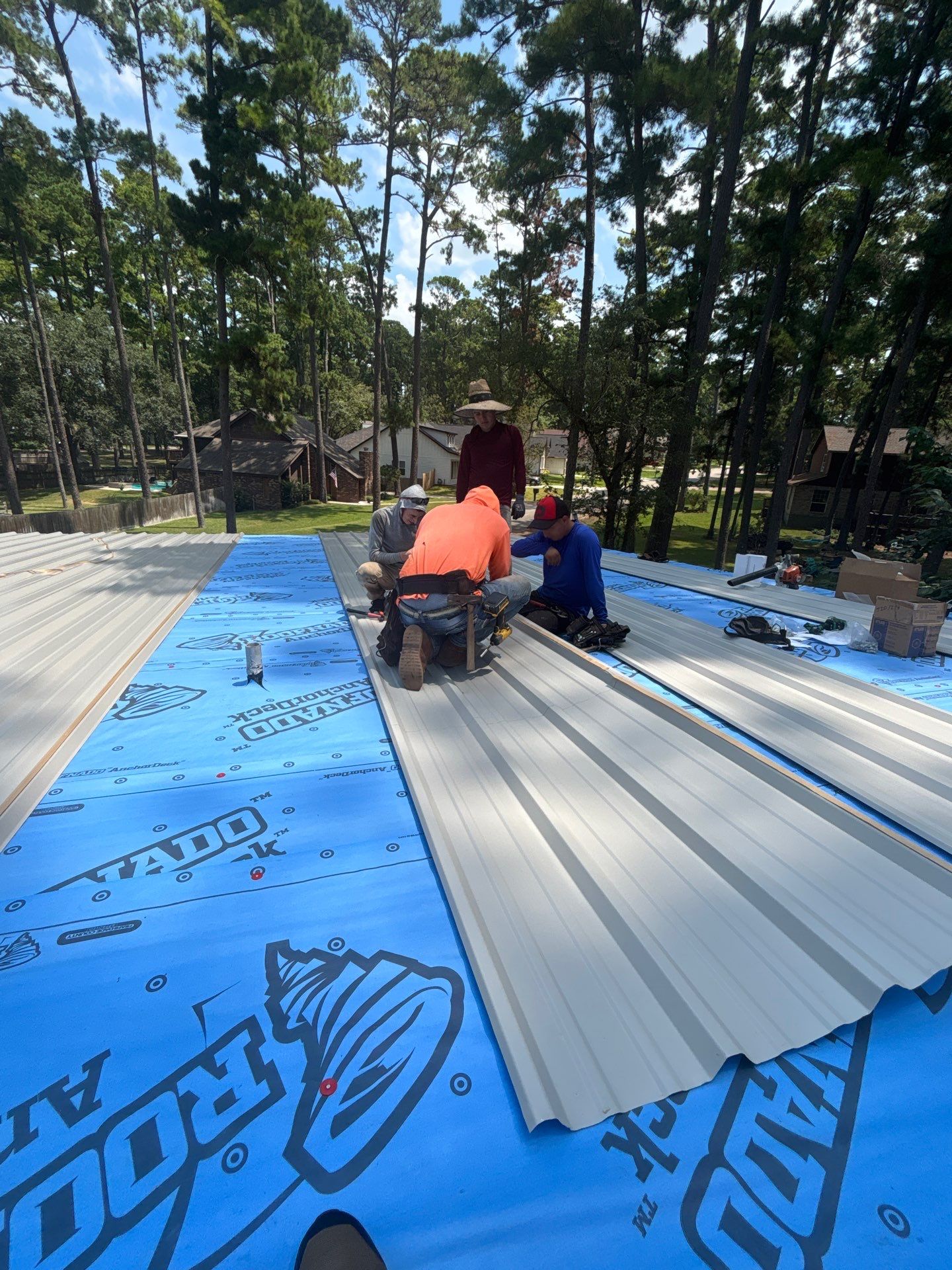 White Standing Seam Metal Roof Replacement in Willis, Texas by Abbott Roofing Company