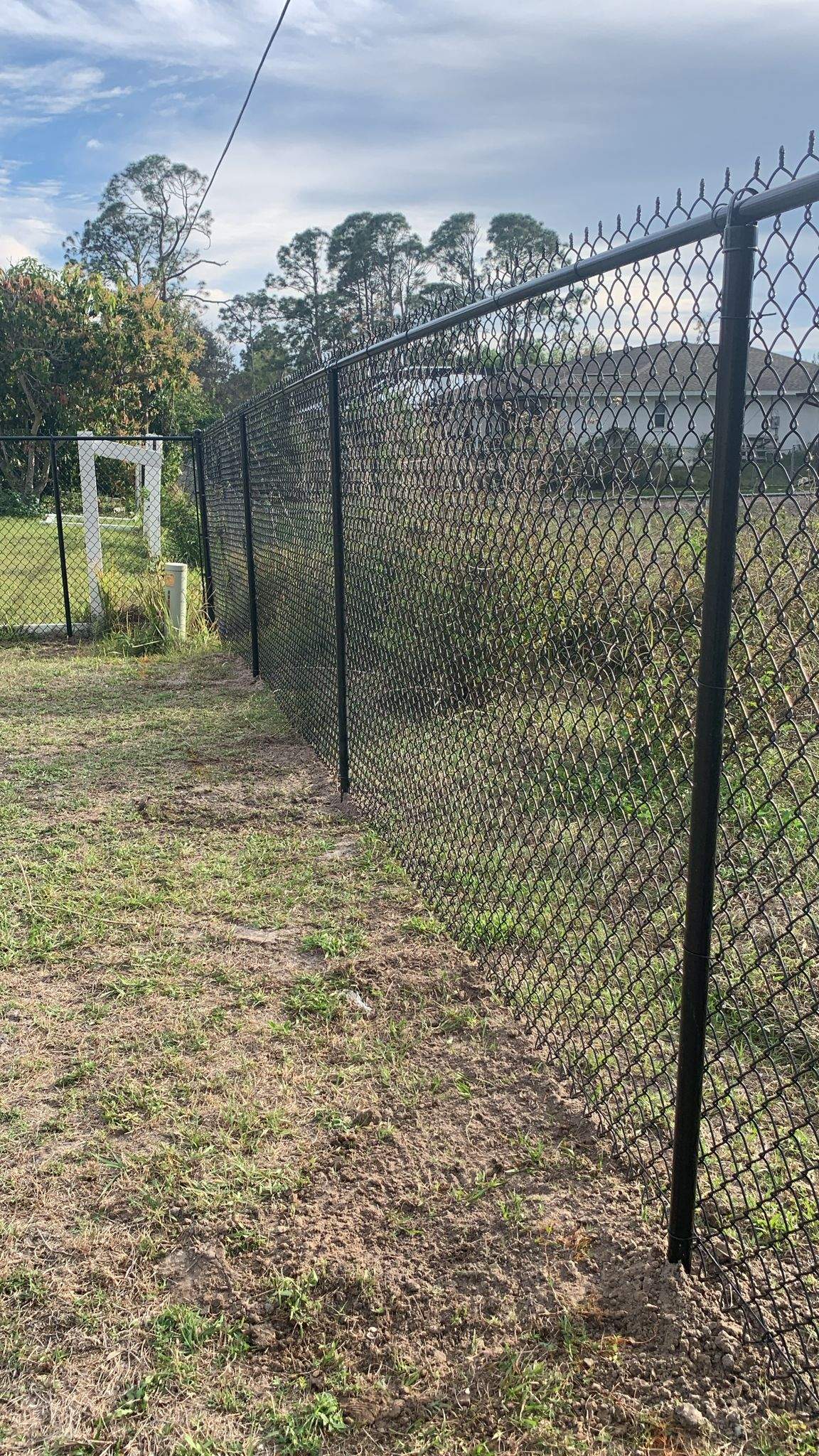 Black Vinyl-Coated Chain-Link Fence Installation in Port Charlotte by True Fence LLC
