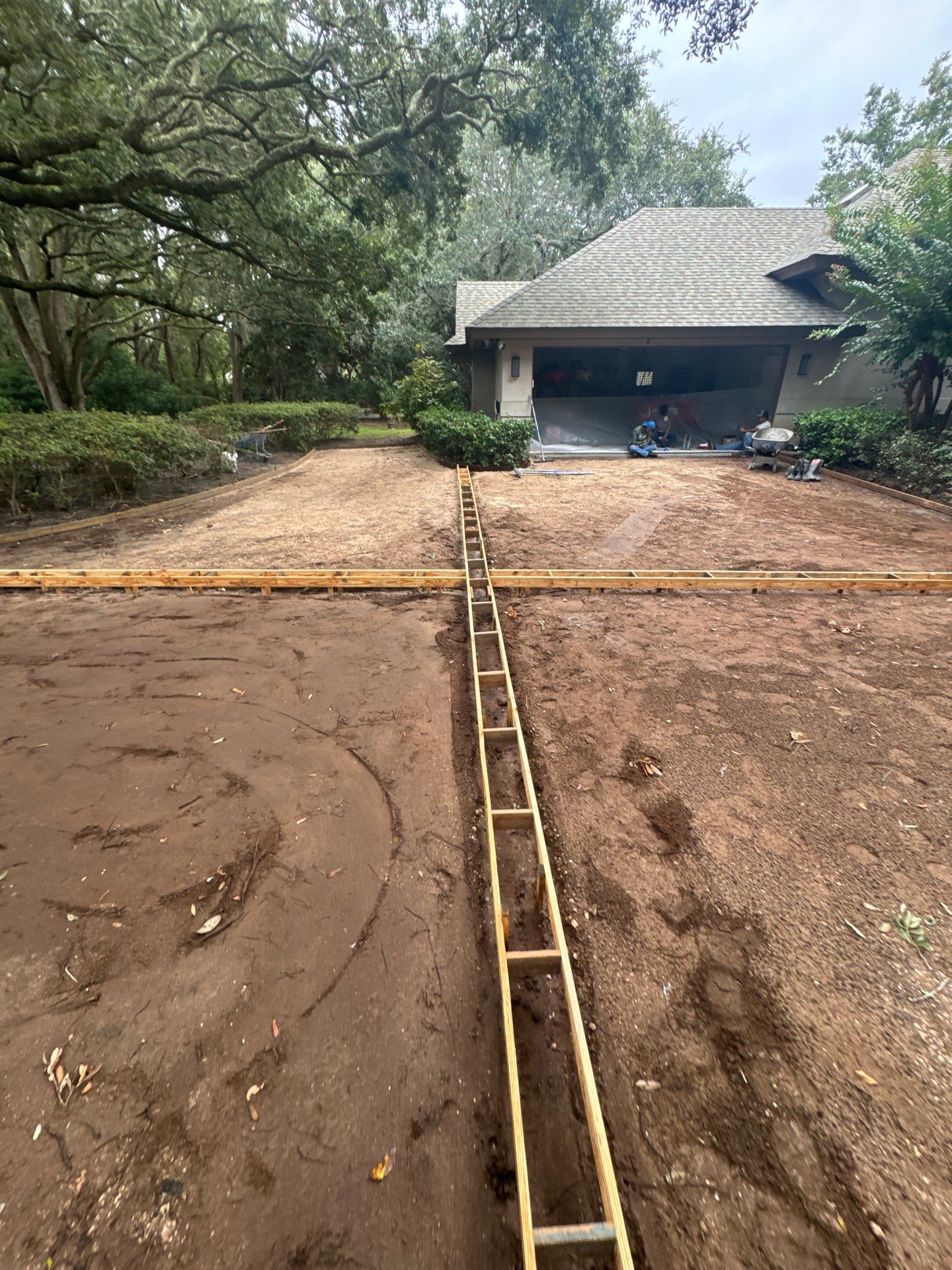 Custom Concrete Driveway with Decorative Paver Inlays in Hilton Head Island by Lowcountry Scapes, LLC
