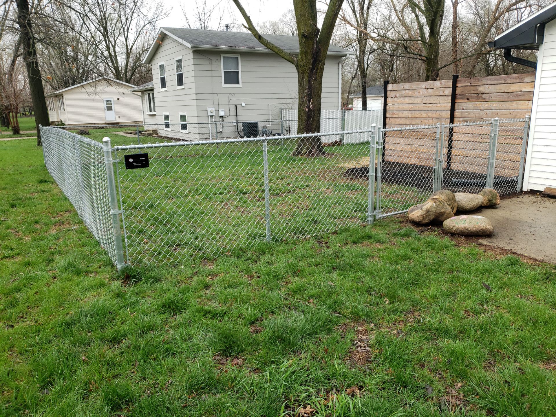 Galvanized Chain Link and Horizontal Wood Privacy Fencing in Waterloo by Perfect Picket Fence and Stain