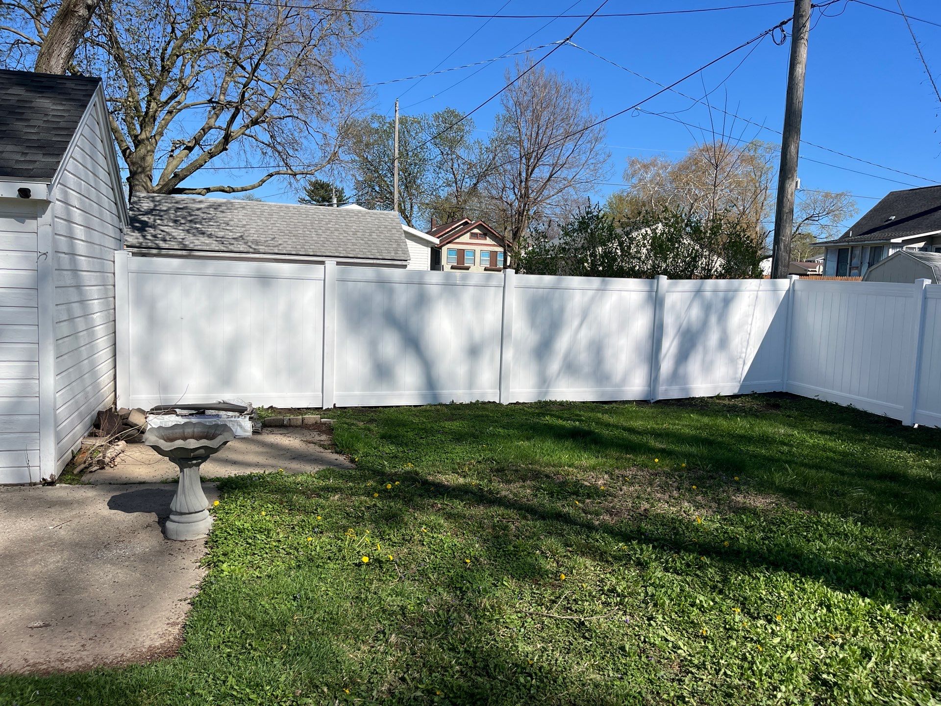 Residential White Vinyl Privacy Fence Installation in Waterloo, Iowa by Perfect Picket Fence and Stain