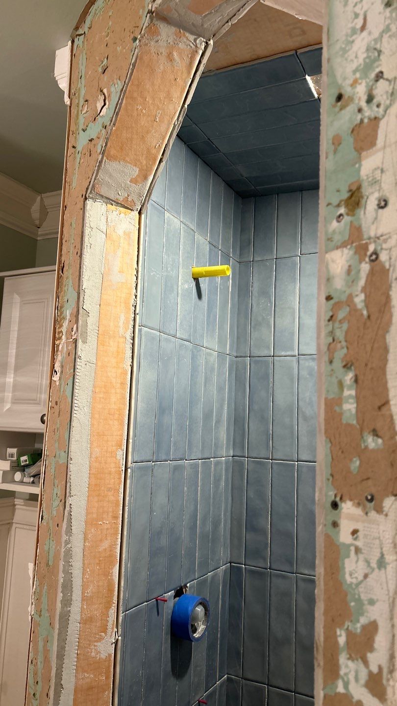 Tile shower and floor by Footprints Floors of Nashville