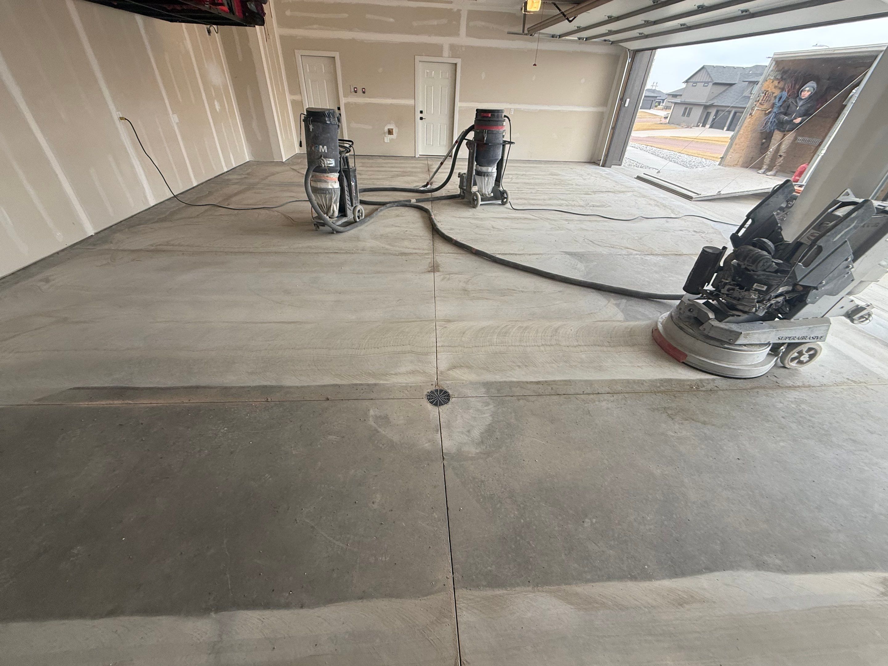 Grey Speckled Epoxy Floor Coating for Sioux Falls Garage by Select Painting, Coatings & Garage Cabinets