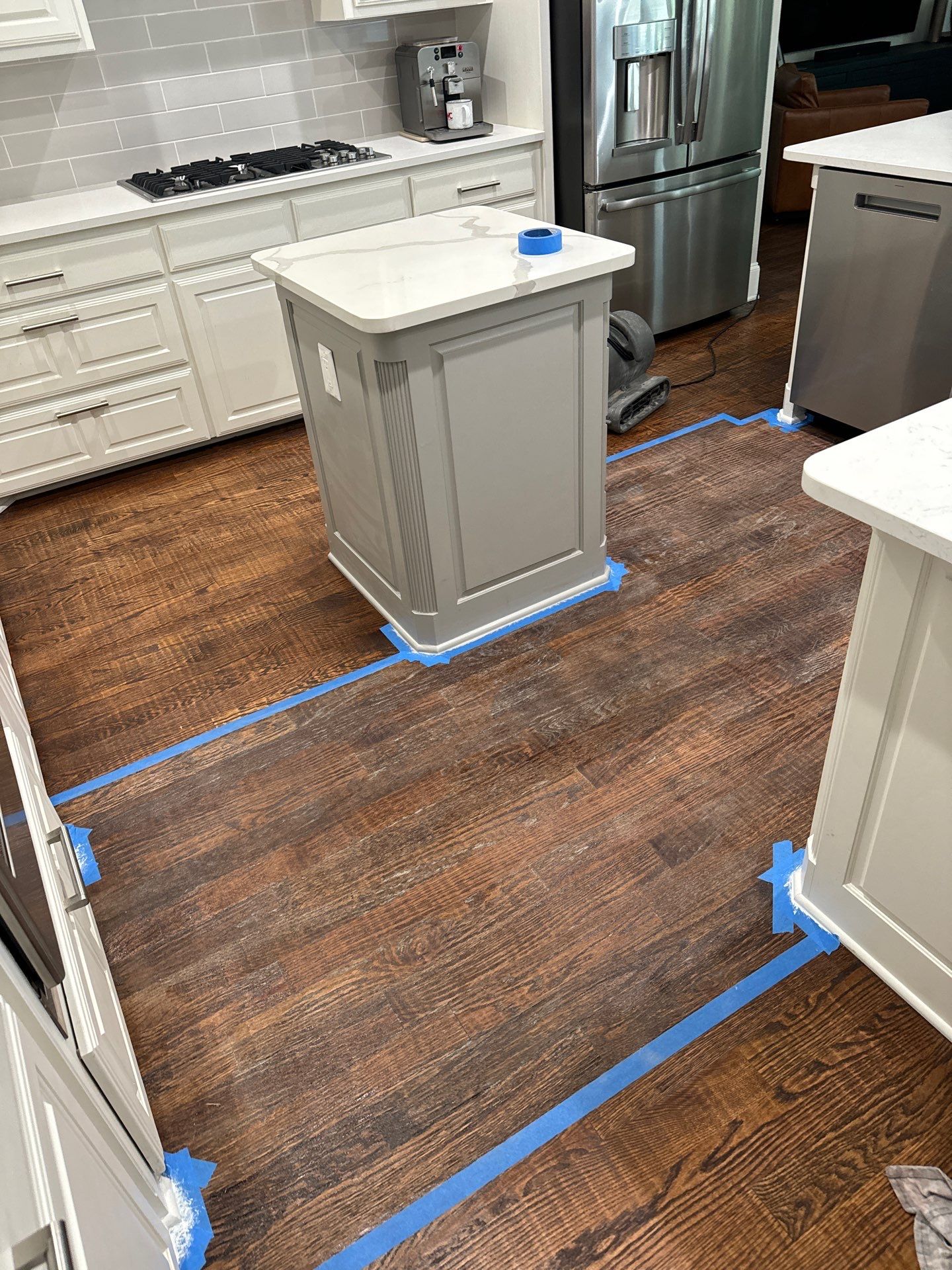 Dishwasher Flood Repair by Fine Line Flooring Inc.