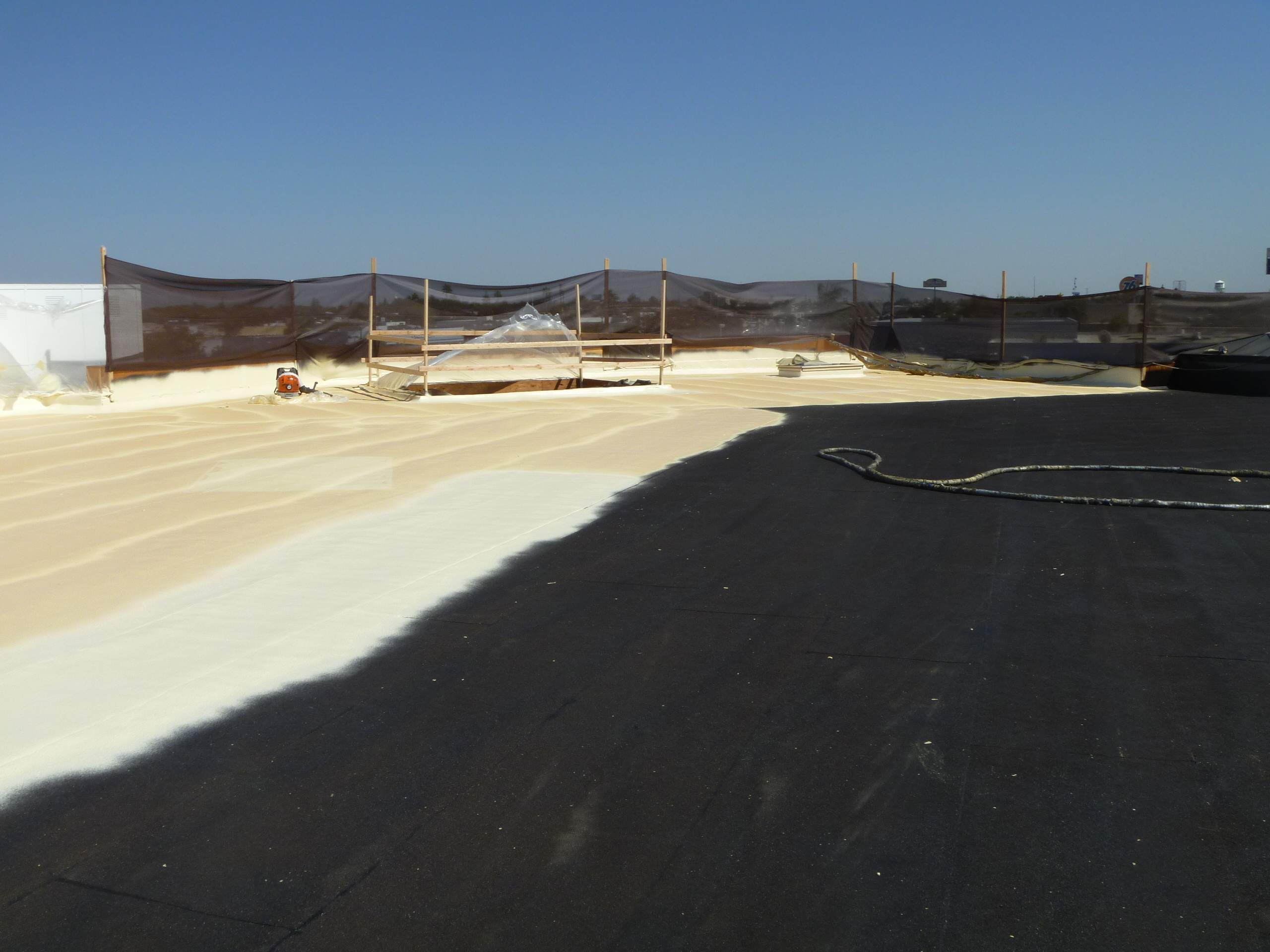 Commercial Roofing Installation using Spray foam and Conklin Benchmark/PUMA XL 18 yr warranty coatings by Straight Edge Roofing Inc