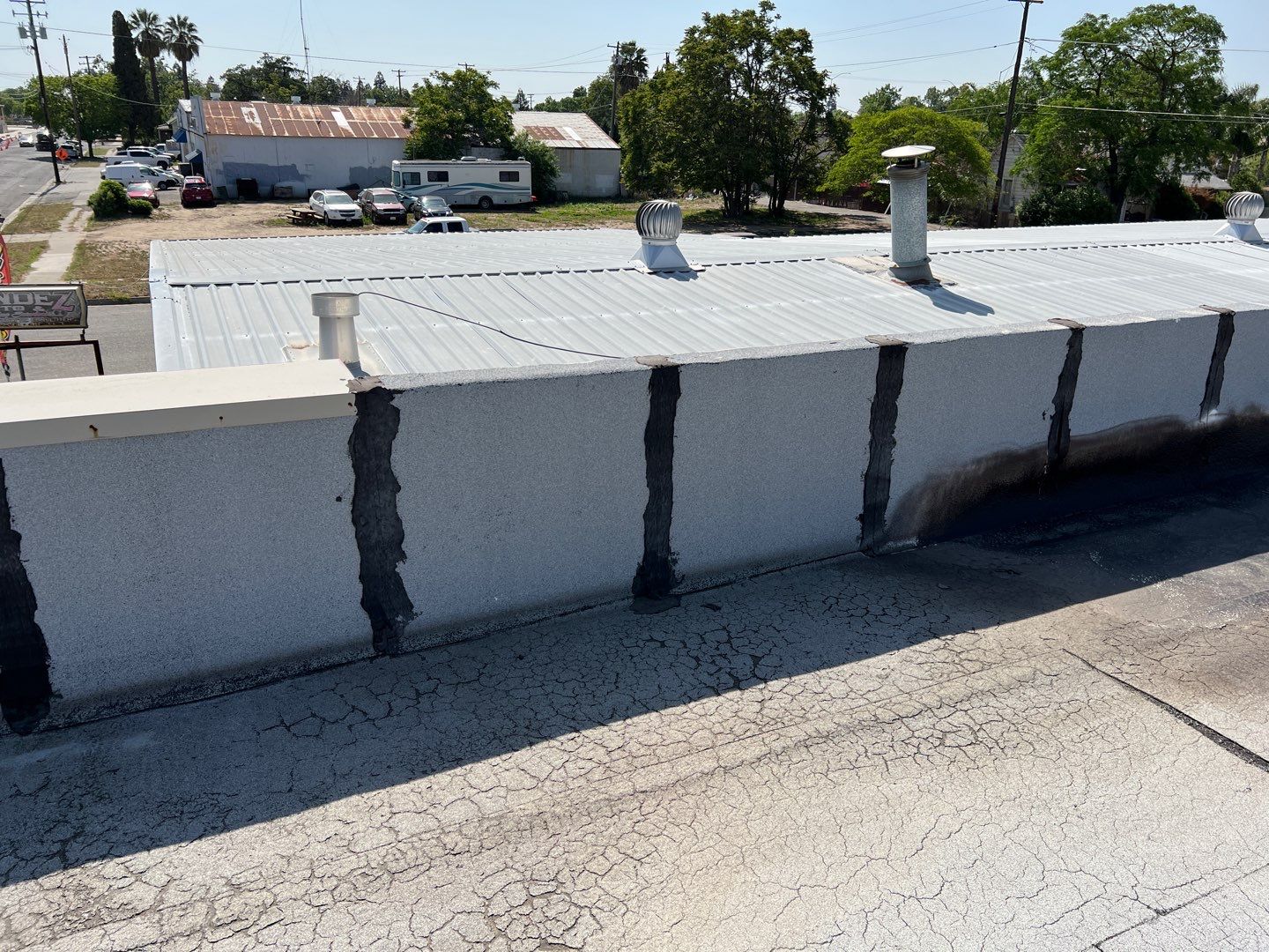 Spray foam and coatings using Conklin Benchmark/PUMA XL coatings and spray foam by Straight Edge Roofing Inc