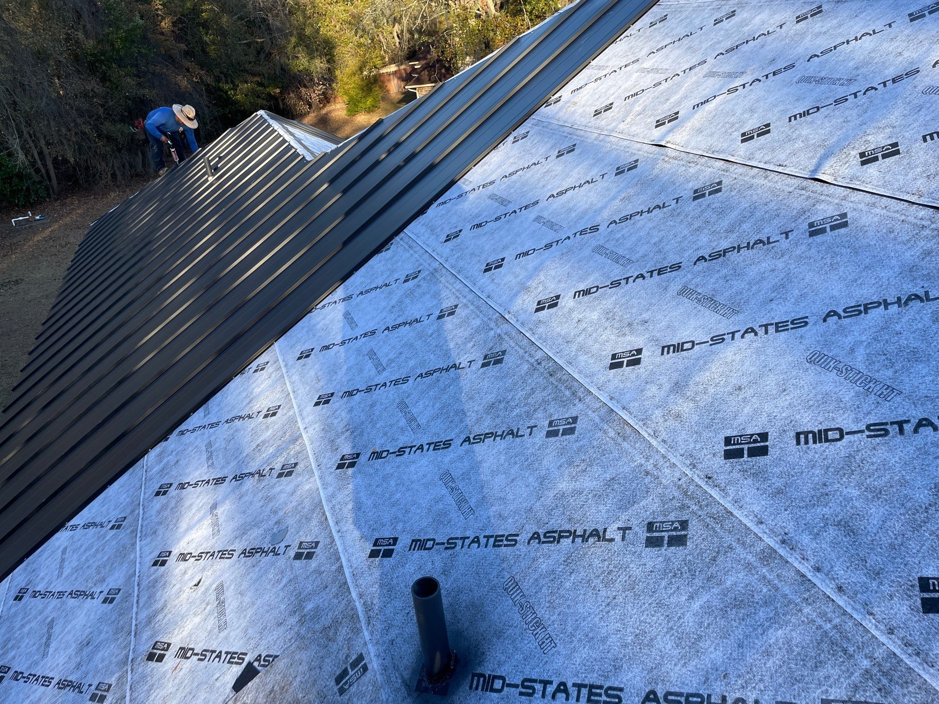 Residential Roofing Installation using Benton 26Ga 1inc Snapcock Metal Roof KYNAR Matte Black by Talya Roofing
